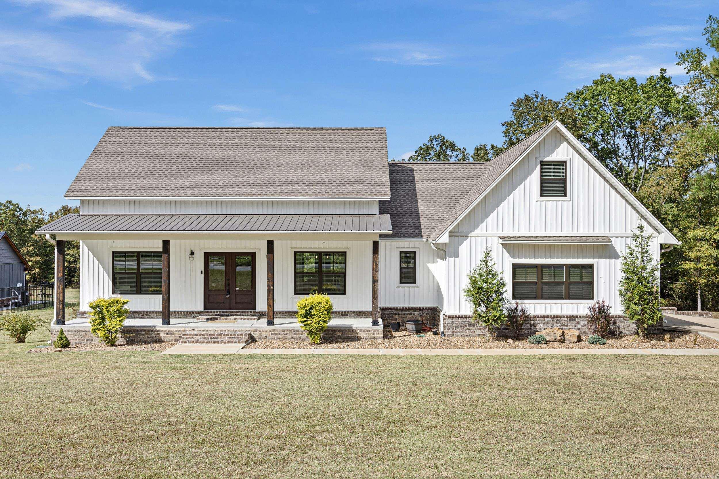 Nestled on over an acre of serene land, this charming 4-bedroom, 3-bath home perfectly balances comfort and style. The split floor plan offers privacy, making it ideal for families or guests. Each bedroom is generously sized, and the large walk-in closets provide ample storage—what a dream for organizing clothes and treasures alike! As you enter, you'll appreciate the warmth of the fireplace, inviting you to cozy up on chilly evenings. The heart of the home seamlessly flows into the spacious living area, ideal for entertaining friends or spending quality time with loved ones. Natural light floods the space, creating an uplifting atmosphere. Let's set up a showing today!
