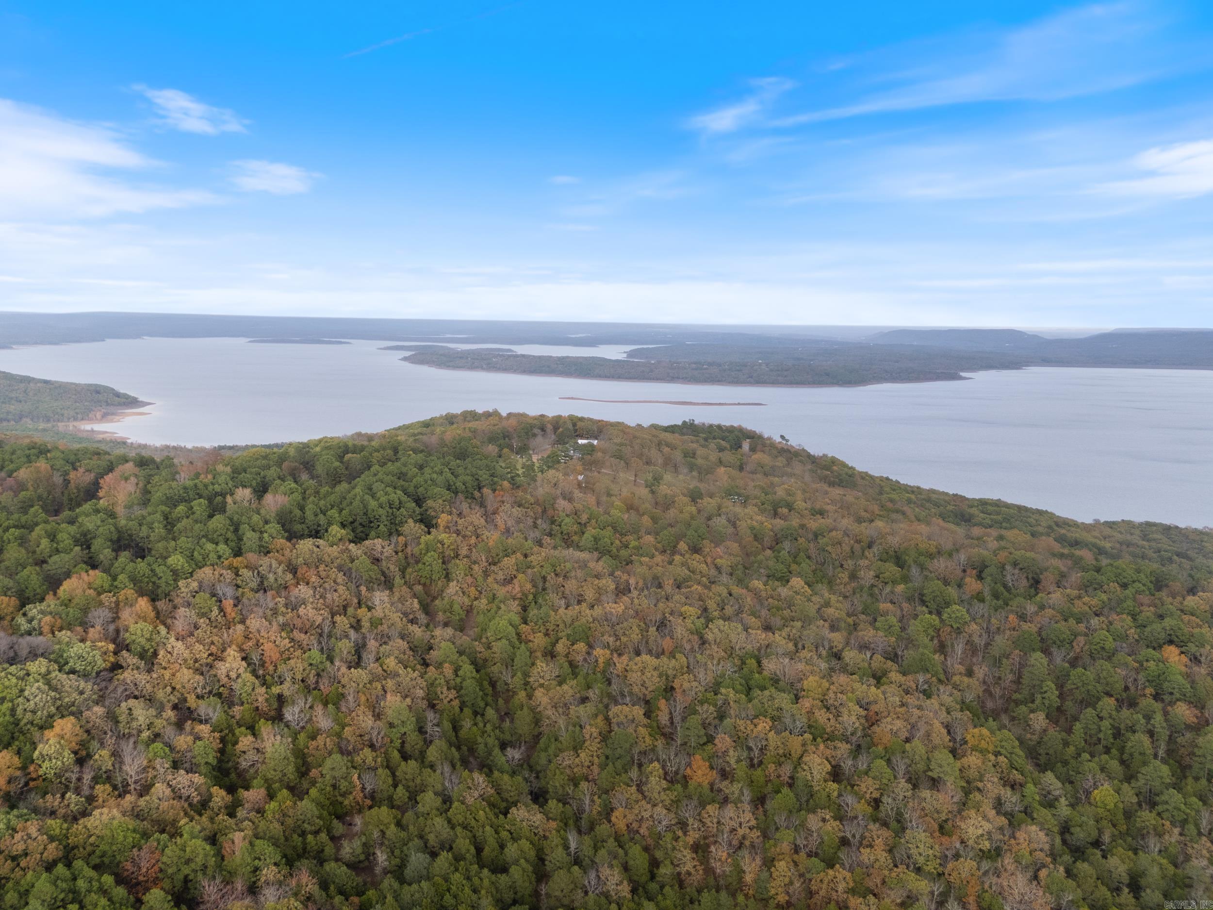 Enjoy the stunning views of iconic Greers Ferry Lake from the exclusive Enchanted Bluff Estates. Located in a quiet subdivision on Honeysuckle Lane with views of Gerry’s Ferry Lake, you're just a short drive several boat ramps with an increidble view overlooking Cove Creek. This is the perfect spot to build your NextHome. Conveniently located between Heber Springs and Greers Ferry, you have your choice of several marinas and boat ramps; golf at one of 2 courses in Fairfield Bay or at Red Apple Inn Country Club on Eden Isle. Call today to schedule a showing!
