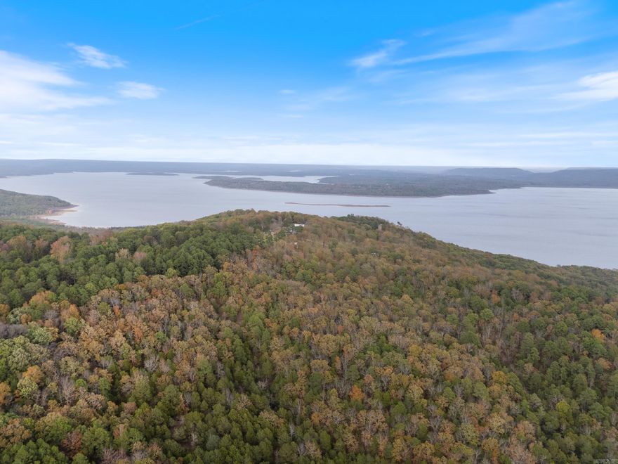 Enjoy the stunning views of iconic Greers Ferry Lake from the exclusive Enchanted Bluff Estates. Located in a quiet subdivision on Honeysuckle Lane with views of Gerry’s Ferry Lake, you're just a short drive several boat ramps with an increidble view overlooking Cove Creek. This is the perfect spot to build your NextHome. Conveniently located between Heber Springs and Greers Ferry, you have your choice of several marinas and boat ramps; golf at one of 2 courses in Fairfield Bay or at Red Apple Inn Country Club on Eden Isle. Call today to schedule a showing!
