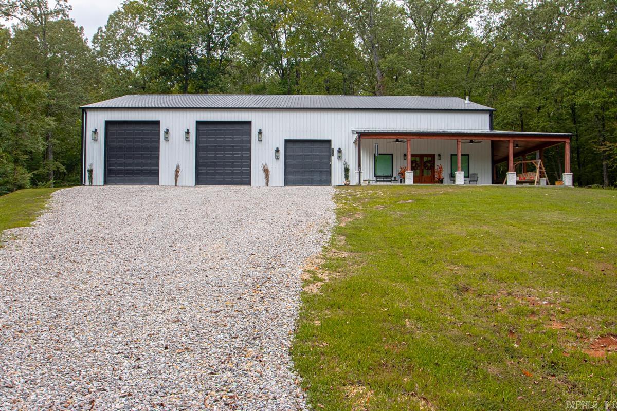 WOW ..... WELL DESIGNED BARNDOMINIUM THAT STATES QUALITY AND DESIGNED FOR COMFORT.... Amenities Include: Approximately 2542 Square Feet, 2 Bedrooms, 3 Bathrooms, Living / Dining Combo, Kitchen / Dining Combo, Breakfast Bar, Large Kitchen Island, Pantry, Abundance of Cabinets and Chef's Kitchen ( Wall Oven, Microwave, Drop in Gas Range ), Spacious Living Room with Gas Log Fireplace, Large Primary Bedroom with Large Walk-in Closet, Primary Bathroom with Custom Tile Shower and Free Standing Tub, Upstairs boasts bedroom with Walk-in Closet and Full Bathroom, Loft Area that overlooks the downstairs, 59' x 60' foot shop area with 2 - 12' wide x 14' tall garage doors and 1 - 10' wide x 10' tall garage door, Large Wrap around Sitting Porch/Patio with wood burning fireplace, entire Barndominium is spray foam insulation, all sitting on a private Tree Shaded 3.79 acre lot +/-. And Much More... A Must See..