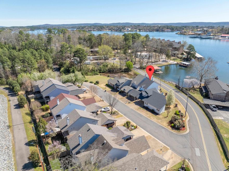 You will Love Living at 110 Lake Pointe Cove!  This 2 Bedroom, 2.5 Bath Garden Home is located in the 7 South Area and Offers the Convenience of being close to Shopping, Dining and ALL Things Hot Springs.  The Living, Dining, Kitchen, Powder Bath and Laundry are on the Main Level, while the 2 Bedrooms, each with an attached Full Bathroom, are Upstairs.  The Primary Bedroom features a Walk-in Closet and a Private Covered Deck with Lake Views.  The Back Deck offers Nice Lake Views as well!  The Interior is Light and Bright with Lots of Natural Light from the Many Windows.  2 Car Carport.  Good Storage.  The Neighborhood is Quiet.  Call Today to Schedule a Showing!  Tenant is responsible for All Utilities.  Application, Satisfactory Background Check and Income Verification are Required.  Minimum 12 Month Lease.