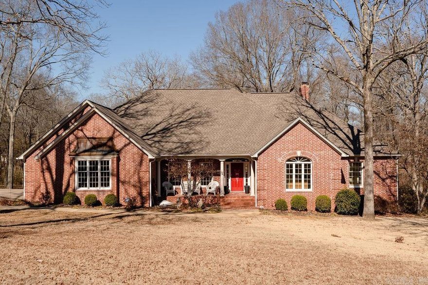 Welcome to this beautifully updated 3 bedroom, 2 bath home on over an acre with a scenic creek at the back of the property and the potential for a half bath. This home features hardwood floors and crown molding throughout, Anderson windows, an encapsulated space under the home, and a storm shelter in the garage.   The kitchen is equipped with quartz countertops and newer Kitchen Aid appliances, including a built-in oven, warming drawer, and ice maker. The luxurious primary bath, remodeled less than a year ago, offers a fully-tiled walk-in shower, a freestanding bathtub, and quartz countertops. Additional upgrades include a newly-remodeled laundry room/pantry, new roof (2 years), Trane HVAC (4 years), sprinkler/irrigation system, and two hot water tanks.   The 24'x30' insulated shop is divided into two rooms and includes water with sink, hot water tank, granite countertops, cabinets for storage, two window air units, a floored attic, and a bricked front with double French doors. Plenty of room for storage and use of tools. One or both sides could easily be converted for relaxing or entertaining.  Come see this rare property offering space, quality, and privacy- inside and out!
