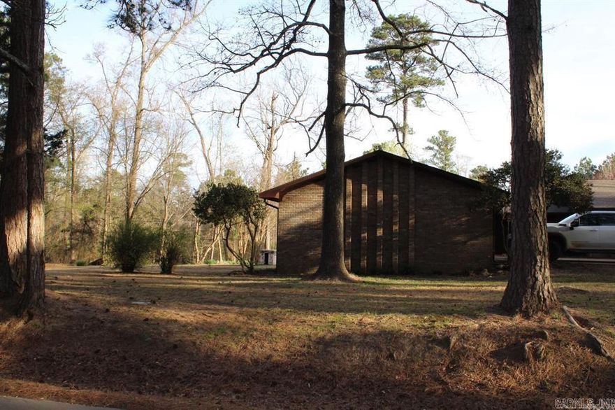 Large kitchen with Granite counter tops, built in wall oven. Formal dining area. Large family area features beamed ceiling and massive wood burning fireplace.