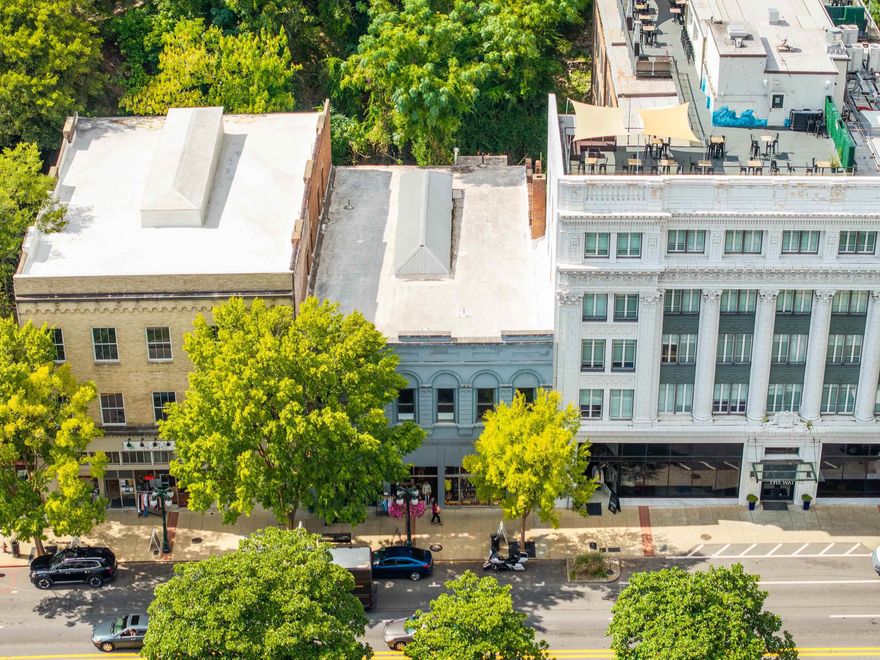 Prime Investment Opportunity in the Heart of Historic Downtown Hot Springs! Own a remarkable piece of Hot Springs history with this iconic downtown landmark—next door to The Waters Hotel, overlooking Bathhouse Row and steps away from the Arlington Hotel. Boasting 8,534 square feet of architectural charm, this building is perfectly positioned to capture the year-round energy and tourism of the National Park District. The main level features 4,200 square feet of prime retail space, complete with expansive display windows and a long-term tenant already secured with a three-year lease—making this an immediate income producer! Upstairs, you’ll find another 4,200 square feet of untapped potential—a blank canvas brimming with possibilities. Imagine transforming this open space with its soaring ceilings, original hardwood floors, and stunning skylight into upscale Airbnb suites, luxury condos, creative workspaces, or an event venue that showcases the best of Hot Springs living. With its unbeatable location, history, and built-in cash flow, this property offers a rare chance to invest where tourism, charm, and opportunity converge.
