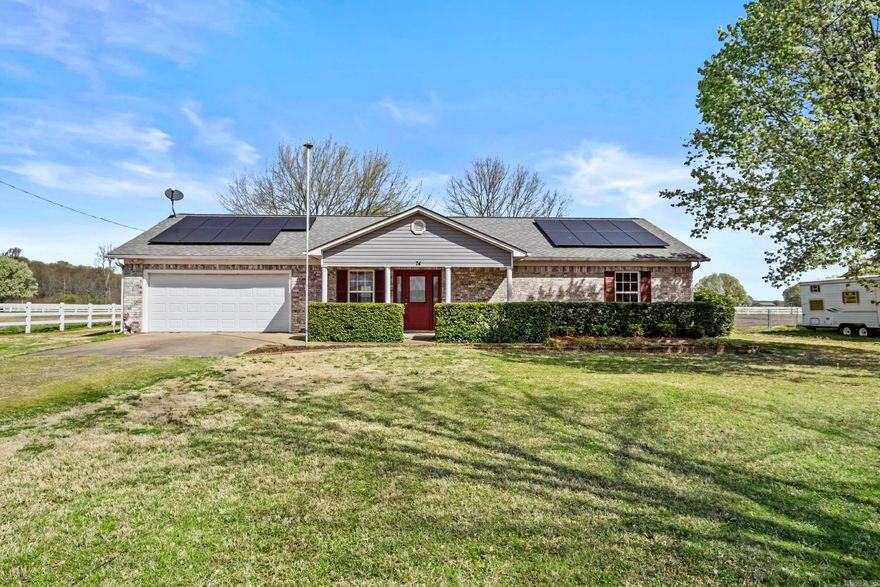 Discover peaceful country living just minutes from the city with LOW ELECTRICITY BILLS!!! This one-owner, well-maintained 3-bedroom, 2-bath home sits on a large lot on a quiet culdesac offering plenty of space to enjoy privacy while also making new friends down the road. Step inside to find beautiful newer floors  in the main living space and a freshly painted interior, creating a bright yet cozy space to call home. Walking into the main living space- see a cute eat in kitchen ready for your personal touch. To the right side of the home, find a full bath in the hall, 3 bedrooms -including the master bedroom at the end of the hall with its large closet and great en-suite bathroom off the master. The backyard is a standout, featuring a wired 12x22 shed with 8 foot door, perfect for a workshop or extra storage. Don’t miss this move-in-ready gem—schedule your showing today! *****Solar panels will be paid off at closing so you get the full benefit! First 4 interior photos are virtually staged for visual inspiration.