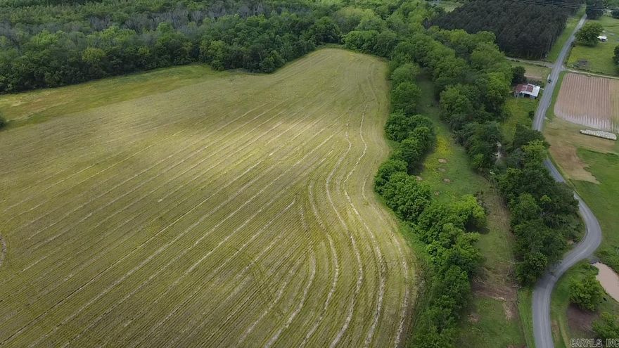 A short drive from the Little Rock Metro area, this attractive property offers the perfect mix of convenience and country freedom. Tucked within a small farming community, it provides an exceptional opportunity for hunters, hobby farmers, or anyone seeking a quiet rural homesite with utilities nearby. With a creek/bayou running along one edge and open fields ready for grazing or planting, the potential for self-reliant living is within easy reach. The property features some existing fencing, and more can be added to make the property suitable for livestock and room to expand into larger pastures if desired. Whether you plan to graze cattle, raise a few horses, or establish a productive garden, the nutrient-rich and well-drained soil provides excellent conditions for a wide variety of crops. For those looking to generate income, the tillable acreage can be leased to a local farmer, allowing you to enjoy the land while it helps pay for itself. An existing well is in place to allow irrigation of crops. Outdoor enthusiasts will appreciate the strong hunting appeal of this area. Surrounded by neighboring properties managed for wildlife, the habitat here naturally supports a variety of