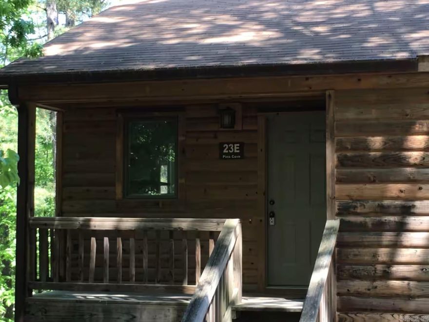 Live that Lake Ouachita Life! This upper unit has been updated and is move-in ready for you! Beautifully renovated 2 bedroom, 2 bath 1128 square foot unit is perfect for a vacation property to use and enjoy or as an investment - or both.  Fully furnished condo in Mountain Harbor! Look at all these updates from 2018: Tile flooring, Carpet, Trim, Epoxy kitchen counters, Appliances, Water heater, some new furniture, all electric fixtures, all plumbing fixtures. Kitchen updates: painted cabinets, removed cabinets over bar, raised upper cabinets and added live edge shelf.  Also included in sale: all new bedding, curtains, art, kitchen furnishings, king bed, twin beds, all furniture, bathroom linens, and streaming TVs.  The association just replaced the front decking, steps and ramps. Roofing was replaced in 2021. Parking lot was updated 2022. There is a winter lake view. Just 100 steps to East cove with spa and Pavillion, East cove pool; beach is also close by. There is also a curtesy dock at the east cove spa building.