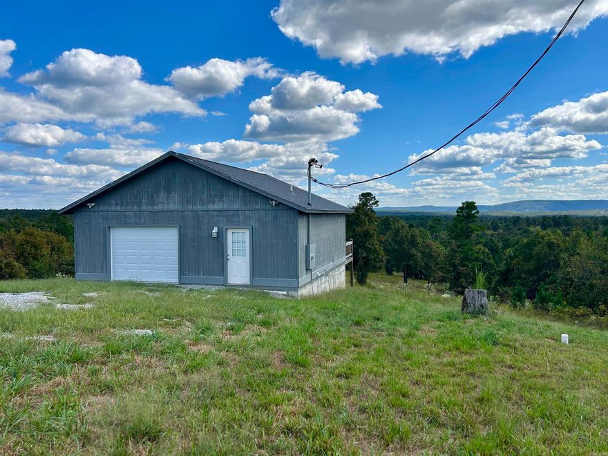 Enjoy the spectacular view of Ozark Mountains from the deck of this sixteen acre property just minutes from the Stone County Courthouse Square in Mountain View and the White River. This unique garage and apartment combination is perfect for a weekend getaway or simple daily living. The private and peaceful acreage offers plenty of room to roam and to enjoy the wildlife, including deer, wild turkey, and bobcats, that frequent the area.