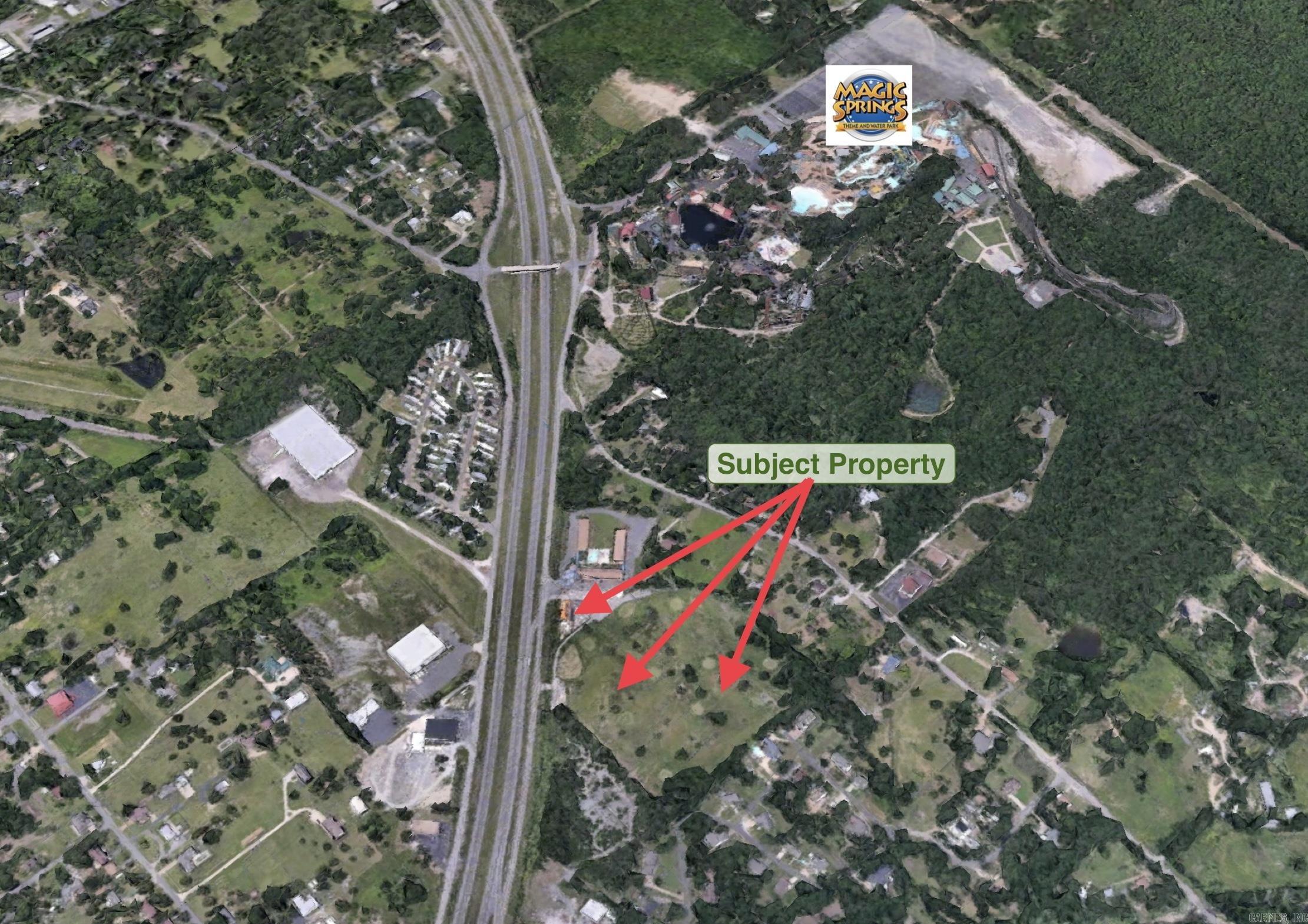 Commercial land development opportunity with high visibility, accessibility, and close proximity to some of the most well-known travel destinations in the South. This property includes 2 adjoining parcels: 1873 & 1875 E. Grand Ave. for a total of 16.03 acres. Zoned C-R/C-4 "Regional Commercial." All utilities on site. Formerly Magic Hills Golf Course. Near Magic Springs Theme & Water Park. 492 ft of frontage. Could be suitable for Retail, Restaurant, Self-Storage, RV Park, Food Truck Park, Gas Station etc.