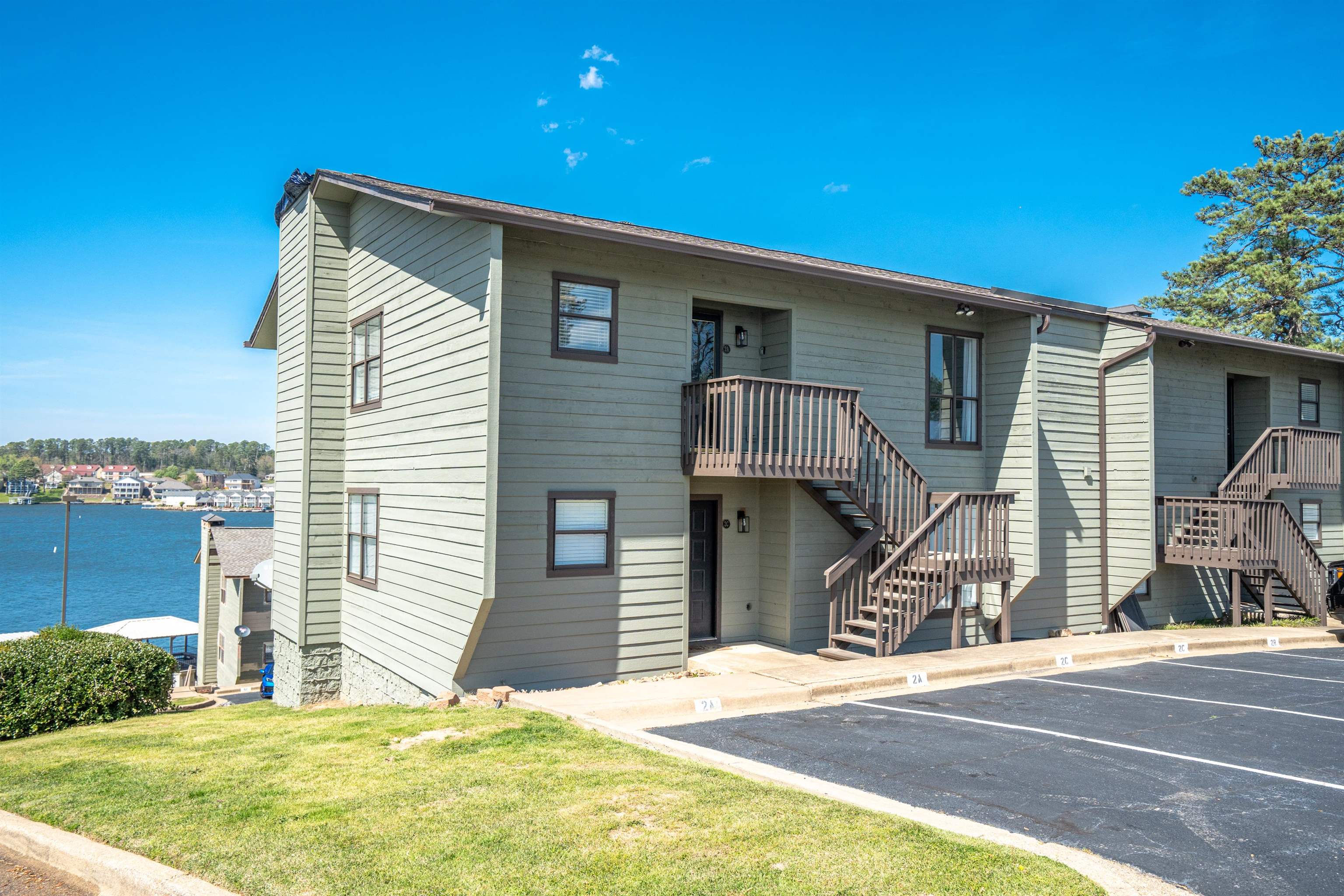 Wake up to breathtaking main channel views on Lake Hamilton! Investors, take notice! This beautifully furnished 2- bedroom, 2-bath condo is perfect for weekend retreat or short-term rentals. BOAT SLIP INCLUDED! Imagine sipping your morning coffee on the patio as the sunrise reflects off the water or unwinding in the evening while watching the fireworks dance across the lake. Located in the sought-after Seven-South area, this gated community offers a swimming pool and pickleball courts, making it easy to stay active and enjoy resort-style living. Just minutes from Hot Springs top attractions, including Oaklawn Racing Casino, local dining, and hiking trails, you'll always have something to explore. Whether you're looking for a PEACEFUL getaway or a prime income-producing property, this lakefront gem is ready for you. Own your own piece of paradise-Schedule your showing today!