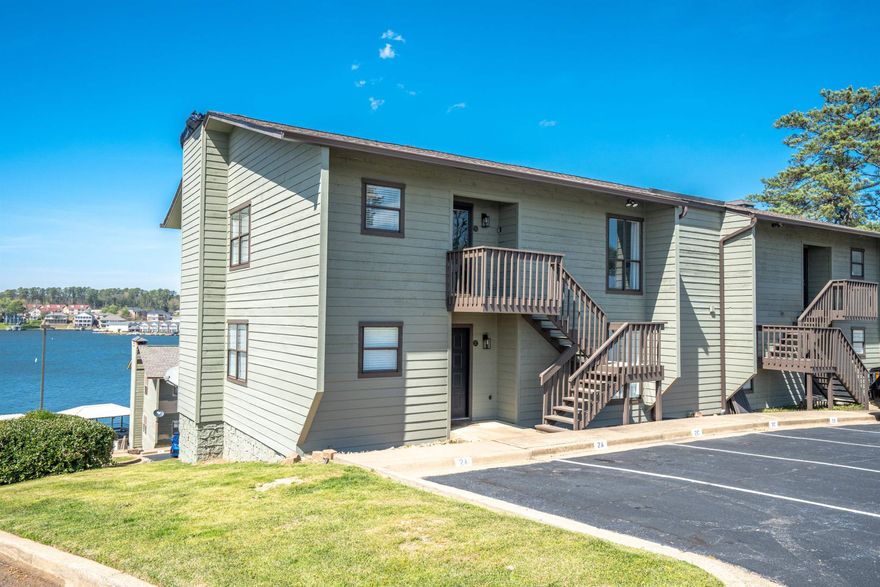 Wake up to breathtaking main channel views on Lake Hamilton! Investors, take notice! This beautifully furnished 2- bedroom, 2-bath condo is perfect for weekend retreat or short-term rentals. BOAT SLIP INCLUDED! Imagine sipping your morning coffee on the patio as the sunrise reflects off the water or unwinding in the evening while watching the fireworks dance across the lake. Located in the sought-after Seven-South area, this gated community offers a swimming pool and pickleball courts, making it easy to stay active and enjoy resort-style living. Just minutes from Hot Springs top attractions, including Oaklawn Racing Casino, local dining, and hiking trails, you'll always have something to explore. Whether you're looking for a PEACEFUL getaway or a prime income-producing property, this lakefront gem is ready for you. Own your own piece of paradise-Schedule your showing today!