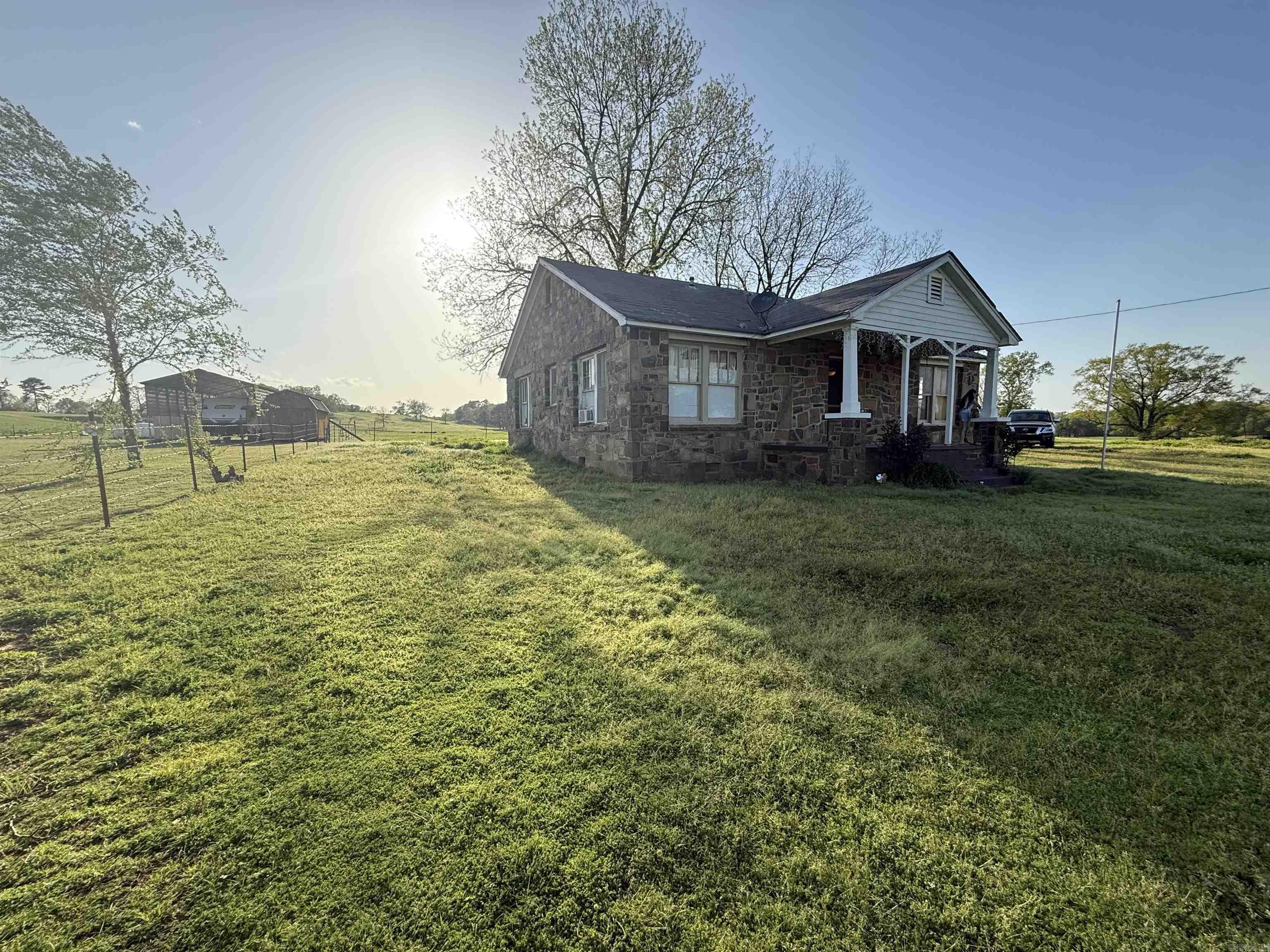 Charming Fixer-Upper on Spacious 0.85-Acre LotOpportunity awaits with this 3-bedroom, 1-bathroom rock home, nestled on a generous 0.85-acre lot. Full of potential, this property is perfect for investors or buyers looking to put their personal touch on a home.While the house is in need of repairs, it offers solid bones and plenty of character to restore or renovate to your liking. The large lot provides ample space for expansion, gardening, or simply enjoying the peaceful surroundings.Conveniently located with easy access to nearby amenities, this property is a rare find for those seeking a project with great potential. Don't miss your chance to make this house your own!Sold as-is. Schedule a showing today!