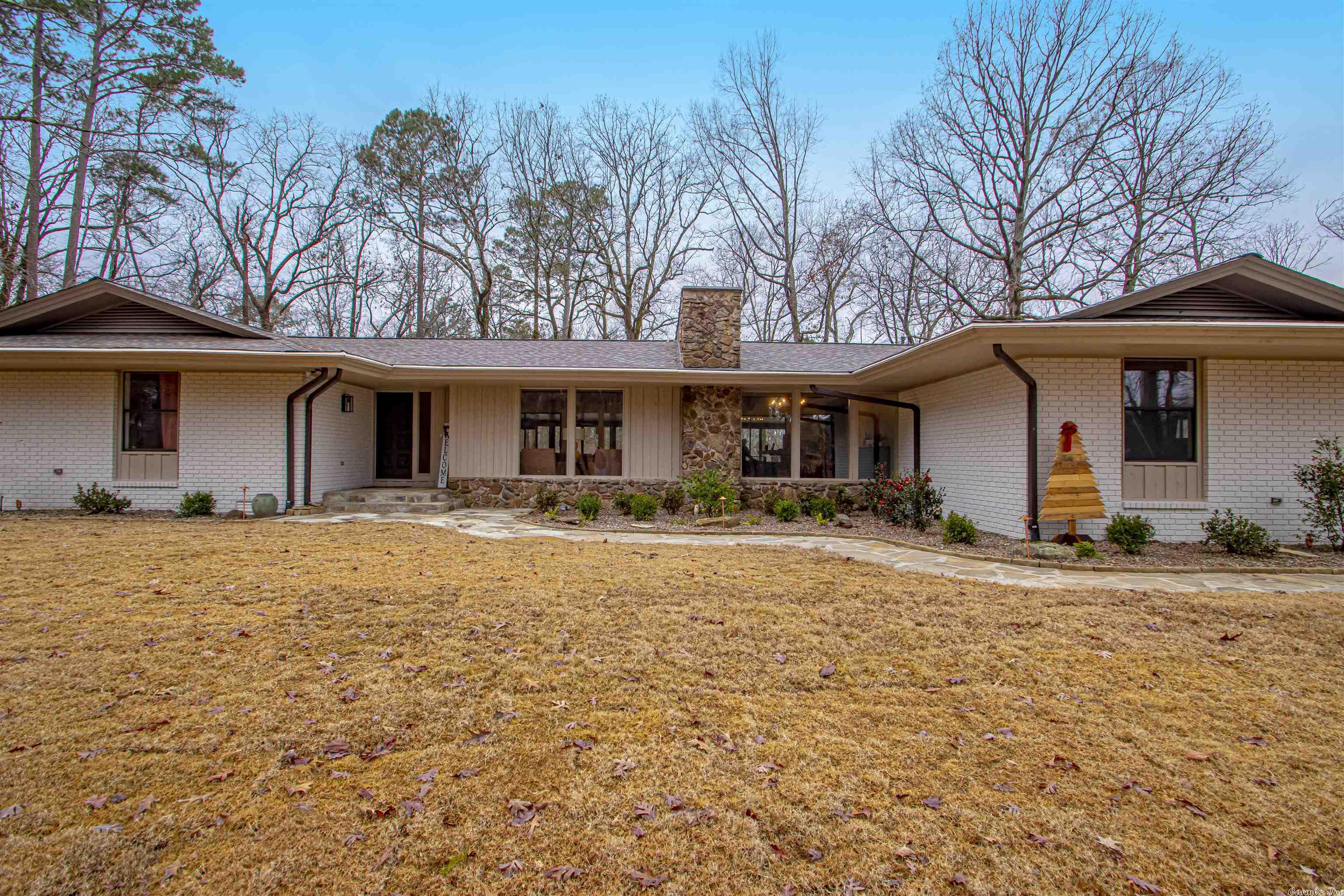 Incredible Private 3841 Sqft Home (2963 main Level and 878 sqft Finished Basement/Game Room) on 6 1/2 Acres Located in Bryant, on Springhill Rd. Very convenient location. New Shop - Plus a Stock Fishing Pond. Large, screened back porch. Finished basement.  Home was completely remodeled in 2020 by Bragg Kennedy Home’s which included: Updating electrical distribution Underground power feed New LED fixtures Updated Plumbing and fixtures All rooms received remodel New Insulated glass was installed in the existing frames (all Windows and Doors) New flooring Basement converted to movie room including new Mini-split AC Whole home vacuum system New roof Duct work modified in rehab New exterior paint  New Driveway   AC ‘s cleaned and inspected 2022 Whole home generator 2021 with Auto transfer switch  (also Powers shop) All Metal 30x40x14 with 12’ overhang shop with auto doors 2021 Pond has been stocked with Catfish and Bream 2020 Septic cleaned and updated 2021