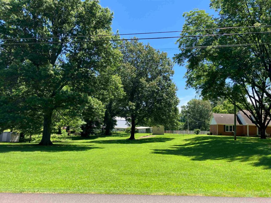 This is a picture perfect 100' x 150' (.34 acres) residential lot with huge, beautiful shade trees! City electric, water and sewer readily available! Listed at $18,000 this hard-to-find lot is ready to build on!!