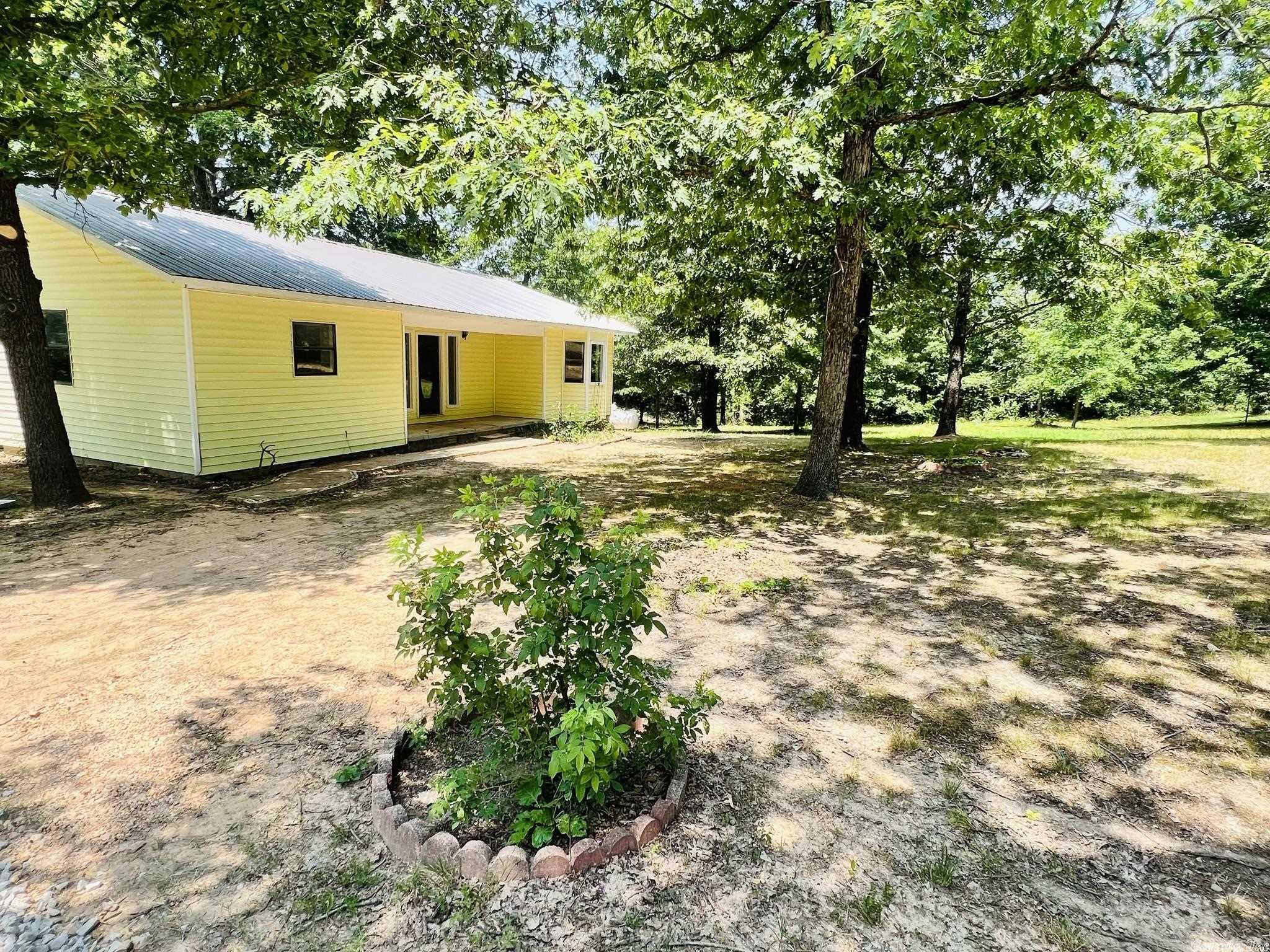 Stunning Remodeled Home on 3 Acres in the Scenic Ozark Mountains! This beautiful 2 bedroom, 2 bathroom home on 3 acres is located in Sidney Arkansas, and has undergone a complete renovation, making it a truly remarkable find, located in the hills of the Ozarks. As you step inside, you'll be greeted by an inviting open floor plan. The kitchen has been fully remodeled with brand-new appliances, giving it a modern and fresh look. The updated flooring and freshly painted walls throughout the house add to the overall charm and appeal. No detail has been overlooked in this renovation, as evidenced by the installation of a new HVAC system, ensuring optimal comfort year-round. The master suite features a full bathroom, allowing for both convenience and privacy. The big trees provide natural shade to enjoy afternoons sitting on the new back deck. A storage building is included, offering practical solutions for your storage needs with a carport covering ensures that your vehicles are protected. DON’T MISS OUT ON THIS OPPORTUNITY TO OWN THIS STUNNING NEWLY REMODULED HOME!! PRICE TO SELL AT $159,900!