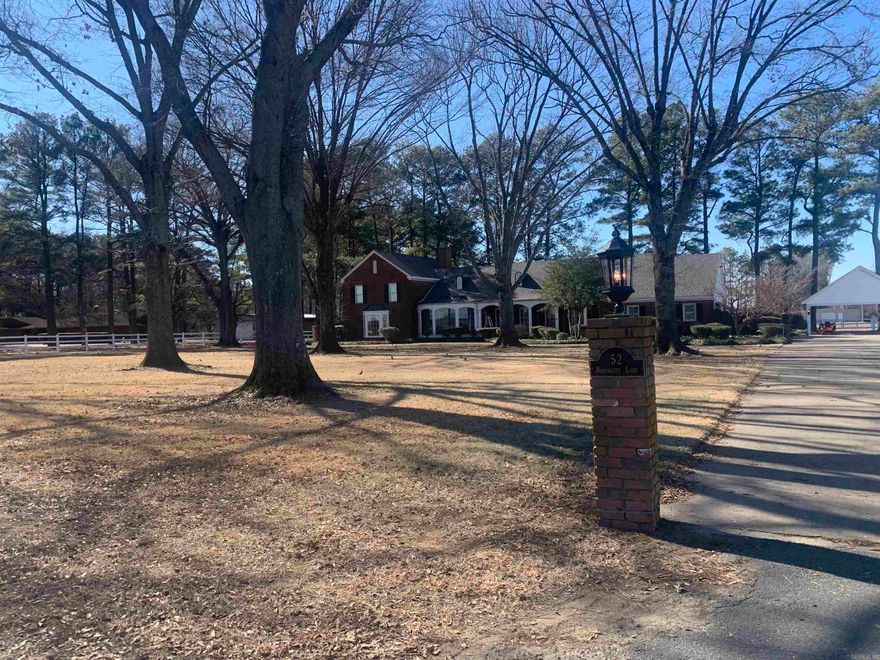 Special Custom Home on 2.83 Acres Outside City Limits. Master Bath 15x26 with Sunken Tub, 2-Person or more Shower, 2-Separate Vanity Sinks, His and Hers Walk-in Closets. Guest Bedroom with 9x6 Bathroom and Closet with Shelves, Medicine Cabinet. Guest Bedroom with 8x8 Bathroom and Closet with Shelves, Medicine Cabinet. Wet Bar in Master Bedroom Sitting area with Fireplace. Wet Bar in Family Room with Fireplace. Separate Full Bathroom Shower 7.7x5.5 next to Family Room and Garage. Playroom 33x22 with 2-Closets, Wall to Wall Cabinets and Shelves. Outdoor Privacy Garden Area 23x16 off Master Bathroom with 2-Entryways, Outlets and Water. Metal Shop 56x34 with Electricity, Water, Internal Air Compressor, Dozens of Outlets. Enclosed Cemented Covered Dog Kennel 10x10 with Water, Electricity. Majestic Hundred Year Old Oaks in Front with Tall Pines in the Back. Natural Gas Heat and Briggs Generator. New Roof. Timed Irrigation System. Ice Maker. Numerous Closets for Storage.   414 SqFt Screened-in Back Porch with 14x14 and 12x10 Rock Porches with Firepit. Footprint of House is 6000 SqFt. Private Gated Neighborhood.  Entry with Personal Code. Great Home for Entertaining, Family Gatherings.