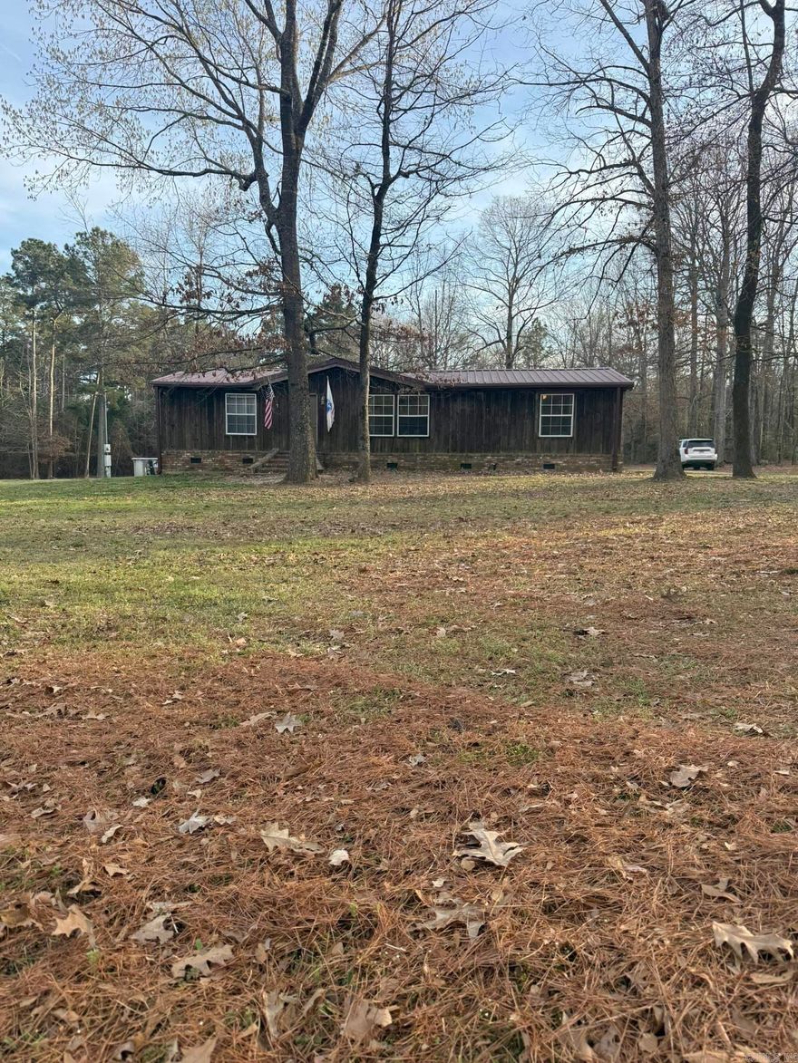 Country living approx 1 mile from Lake Columbia, this property offers 4 acres, a 2,000 sq ft home with 3 bedrooms and 2 full baths.  Galley kitchen with stove, dishwasher and refrigerator to convey.  Spacious living room, dining area, master bedroom with walk in closets.   Property has a nice entertaining deck, above ground pool, double carport, detached shop building and several out buildings.  Contact our office for more details or to schedule a viewing.