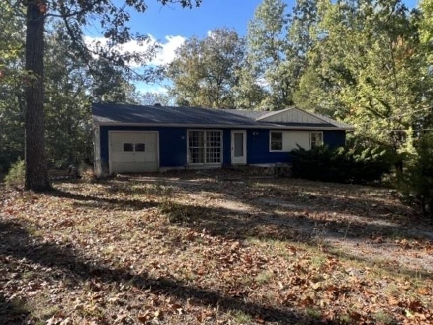 This privately situated one level home on a quiet cul-de-sac is looking for a new owner. It's a 2 bedroom 1.5 bath home with attached garage, large utility room.  The covered back deck has  another room with outside access only.  The roof is newer. Central HVAC.  No seller disclosure is available.  The final List Price/Sales Price is subject to a pending HUD Appraisal.  Due to condition, please use the  hold harmless agreement uploaded in the Documents Tab for anyone entering the property. Submit executed copy to listing agent prior to entering the property.