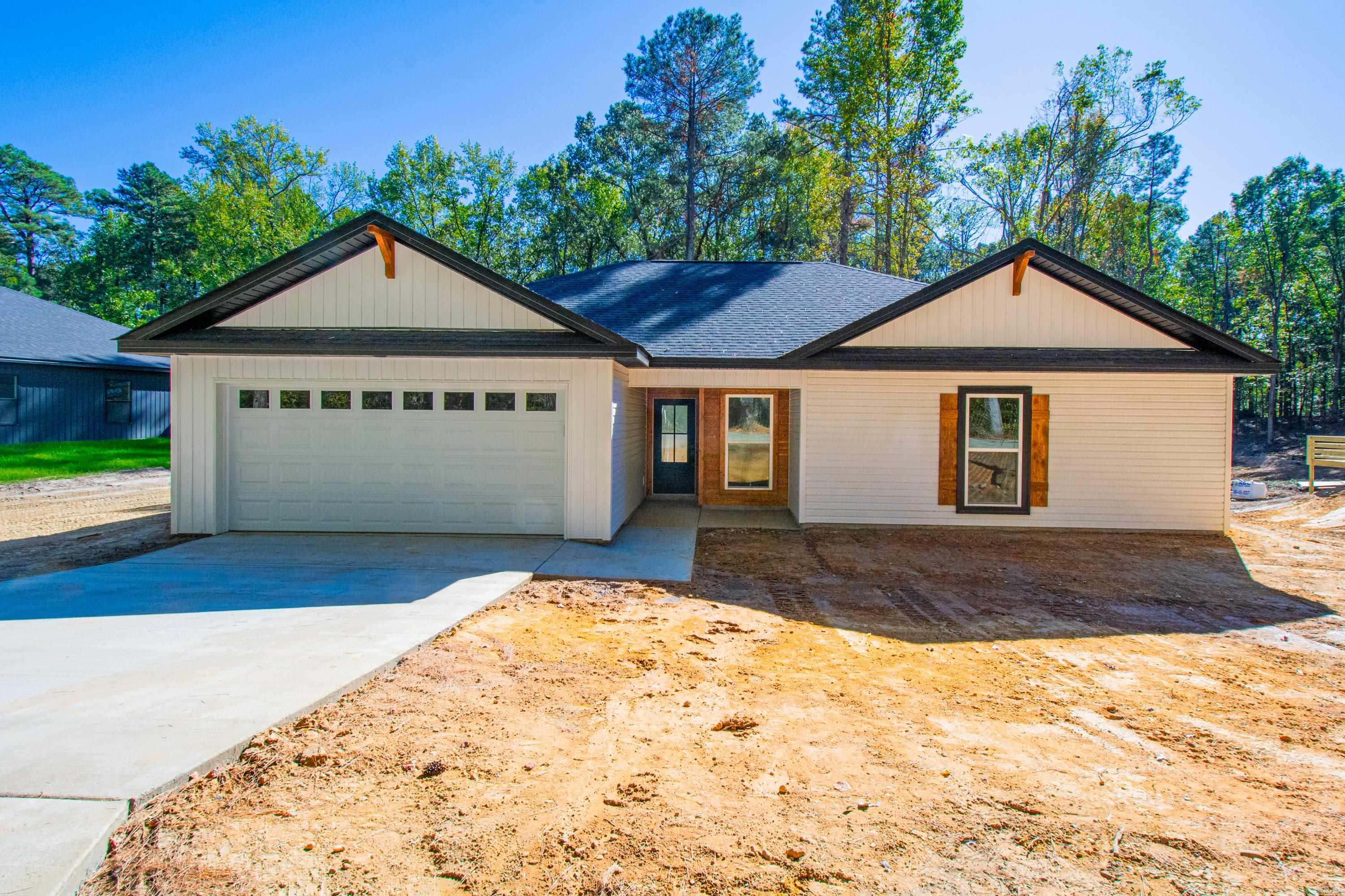 Wonderful new construction. 3 bd 2 ba on large lot. Vaulted ceiling in great room with beams. Electric fireplace. Open floorplan with large island in kitchen. Granite counter tops. LVT Flooring. Pantry. Laundry room. 100 X 100 adjoining lot in rear can be purchased for $15,000 when purchased with house. Convenient to everything. Bauxite School District. Nearly complete.