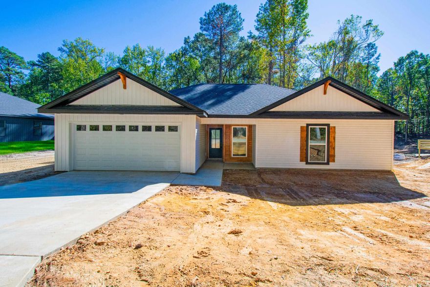 Wonderful new construction.  3 bd 2 ba on large lot.  Vaulted ceiling in great room with beams.  Electric fireplace.  Open floorplan with large island in kitchen.  Granite counter tops.  LVT Flooring. Pantry.  Laundry room. 100 X 100 adjoining lot in rear can be purchased for $15,000 when purchased with house. Convenient to everything.  Bauxite School District. Nearly complete.