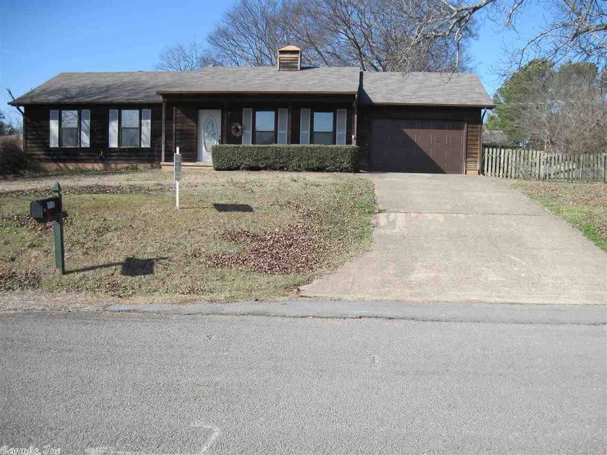 Great one owner home with lots of updates. New roof, interior paint and trim, garage door. Also has new tile in kitchen, laundry and both baths, and new darker laminate in greatroom and hall. New dishwasher. New shutters. Heat and air is approx. 5-6 yrs. Just serviced.   Greatroom has extended ceiling with wood burning double sided fireplace. Also opens to kitchen which also has extended ceiling. 2 pantries in kit. Screened bk porch with concrete floor is not included in sq ft.  House sits on 3 lots.