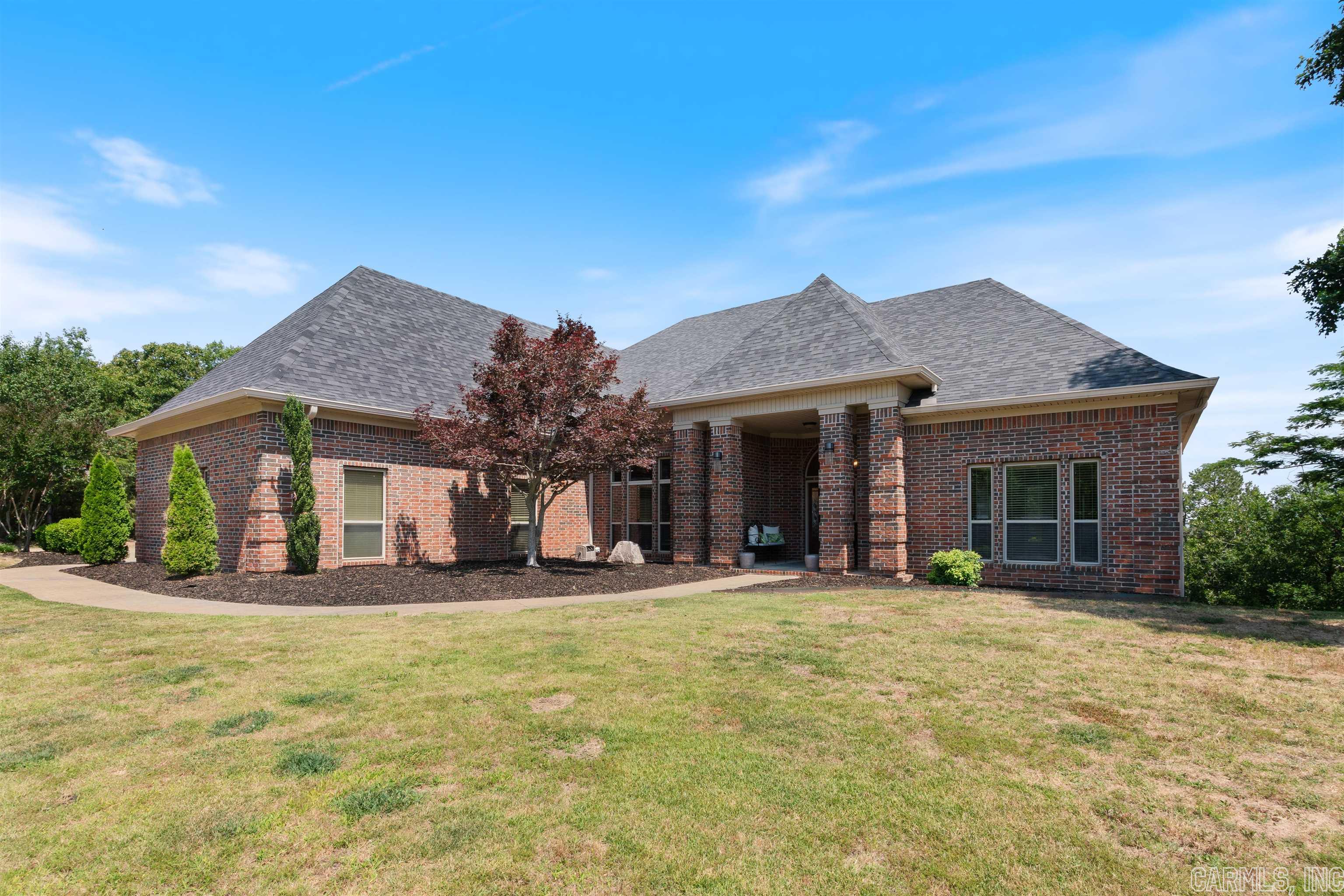 WOW! WHAT A VIEW! This stunning home located at the top of Pinnacle Ridge Rd offers a breathtaking view of Conway. The open concept design of the house is complemented by hickory floors and 12ft ceilings, giving it a luxurious feel. The living room boasts a vaulted ceiling, while the kitchen opens up to a large den and casual dining area. The master bedroom is located on the main level and features a luxurious bath and a separate sitting room. The split bedrooms on the main level are connected by a Jack and Jill bathroom. The walk-out basement he basement of this property is fully finished and offers ample space for entertainment and relaxation. The bedrooms are spacious and well-lit, providing a comfortable living experience. If you are looking for a property that offers a serene and peaceful living experience with a stunning view of Conway, then this property is perfect for you!!
