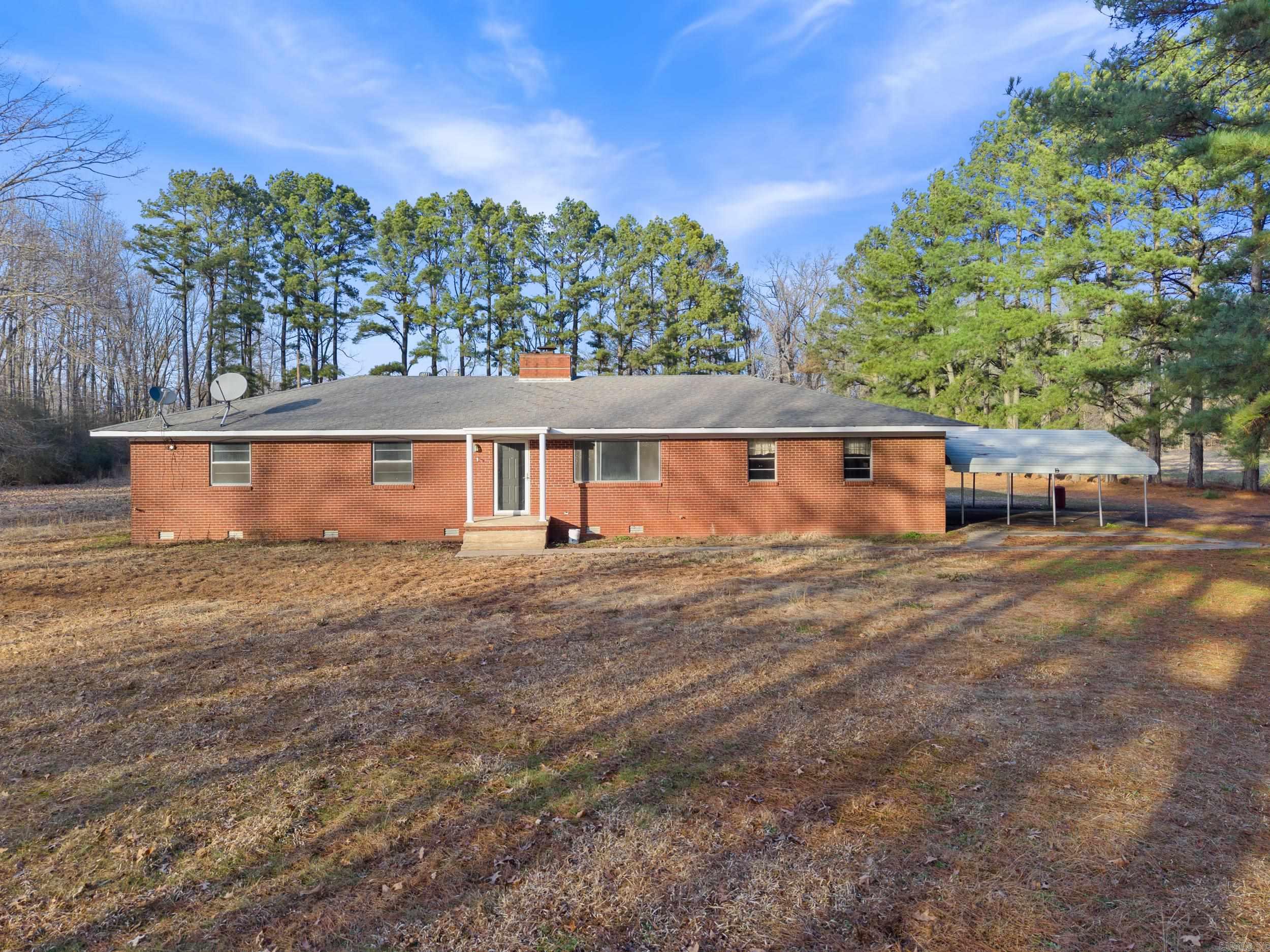 Looking for space, storage, and unrestricted land? This incredible property on Highway 64 offers it all! Nestled on 4.12 acres, this home has been beautifully updated with new subfloor, flooring, paint, and light fixtures—ready for you to move right in! But the real showstopper? The shops and outbuildings! Whether you need room for equipment, hobbies, or business ventures, you'll have tons of storage and workspace to fit your needs. With unrestricted land, the possibilities are endless! Seller is willing to replace the cabinets and counters in the kitchen with solid surface counters for $10,000.00 above ask price. Agents see remarks. Square footage approximate, please measure.