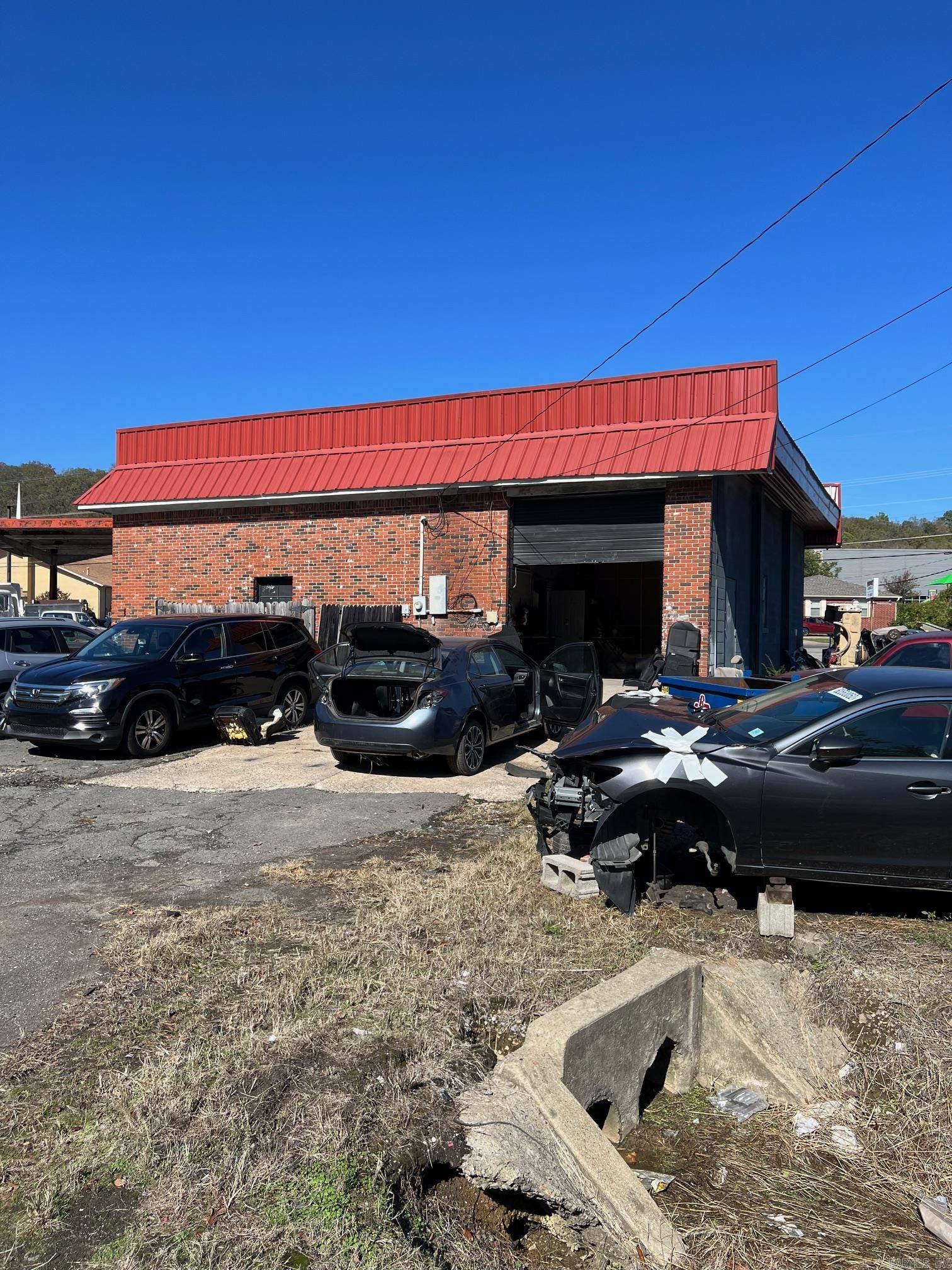 .6 of an acre commercial land with 2,136 sqft building for sale. Currently has a body shop on a month to month lease paying $800/month.