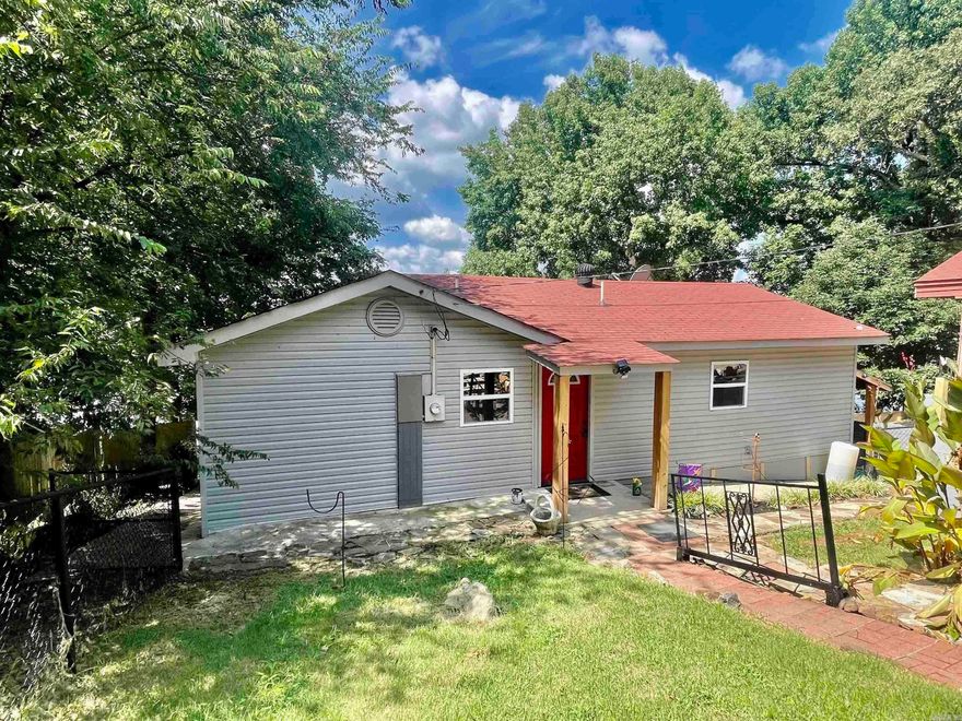 Cute LAKEFRONT bungalow with open floor plan on Lake Conway with a beautiful view. There have been many updates to this home. New exterior siding, decorative iron fencing, new interior paint, New HVAC mini split unit, created a 2nd bedroom area, new laundry area, new 1/2 bath and interior sun room added. New E3Argon windows throughout. Lower kitchen cabinets with pull out drawers, new luxury vinyl flooring in both bathrooms. LED lighting fixtures throughout. Rear deck piers replaced, Storm Shelter, outside storage area, 2 car carport, Roof 2015, Shop room under house. Boat dock will have to be rebuilt. New shower, toilet, and double vanity in master Bath. Walk in closet in master bedroom. This home is all electric, Hot water tank replaced within the last 2 years.