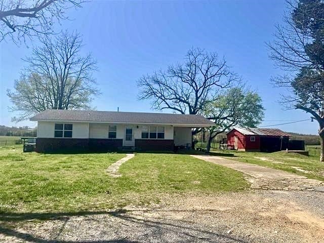 Set on a picturesque 1.32-acre hobby farm, this charming old country home offers classic country living with modern comforts. Two–three mature fruit trees bring a touch of sweetness, while a sturdy barn provides generous storage and a secure storm cellar offers peace of mind when storms roll through. Two fenced areas are ready for dogs or small livestock, and the quaint chicken coop means fresh eggs right out your back door. The inviting 2-bedroom, 2-bath residence features a warm eat-in kitchen and a welcoming back porch that’s perfect for sipping coffee while listening to the birds. Surrounded by stately oaks, this property is a true slice of the good life in the country.