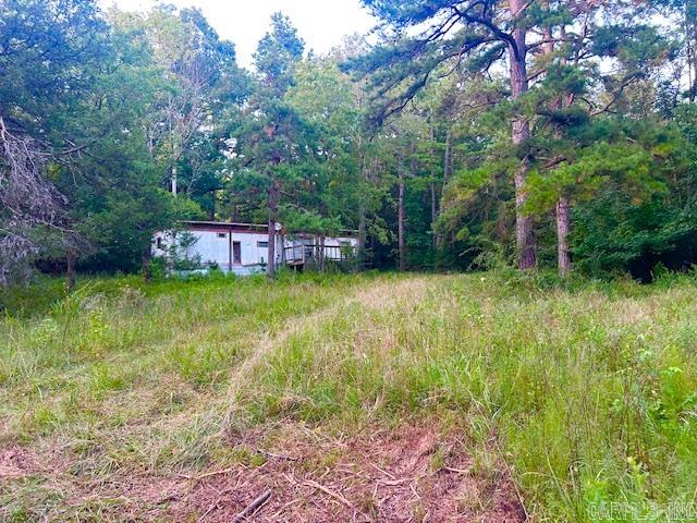 Almost 4 acres with Highway frontage. This property has two older mobile homes on it that someone could fix up. There is a pond. Power, water , septic and a well and 2 propane tanks on the property. Great place for a hobby farm or your nice private place to call home and build a forever home. Both these mobiles could be fixed up for rentals. This could be a great investment for someone. Don't miss out! Call to see it for yourself today.