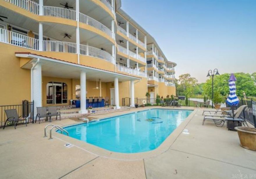Highly desired Grand Isle Condominium fabulously designed! This luxury condo overlooks beautiful Lake Hamilton near the main bridge. Open floor plan, extensive molding, electric fireplace, gourmet kitchen with beautiful backsplash, island, coffered ceilings, large patio overlooks pool and outdoor kitchen, jacuzzi whirlpools in both baths, heated bathroom floors, walk-in closets, two elevators access all floors, enclosed security parking with 2 spaces. Rare opportunity to find such a luxury condo on the market. Enjoy cooking in the outdoor kitchen and sitting poolside with friends and family. Come live the good life you deserve. Call today for your private tour.