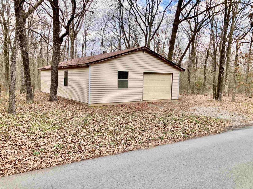 This wonderful lot is located outside of city limits, not on a subdivision and is approx .97 of an acre. It features a large shop approx 26X42 with a overhead door and electrical, other utilities are at the road. Minimal restrictions gives you the freedom to dream and plan. Make this place you own!