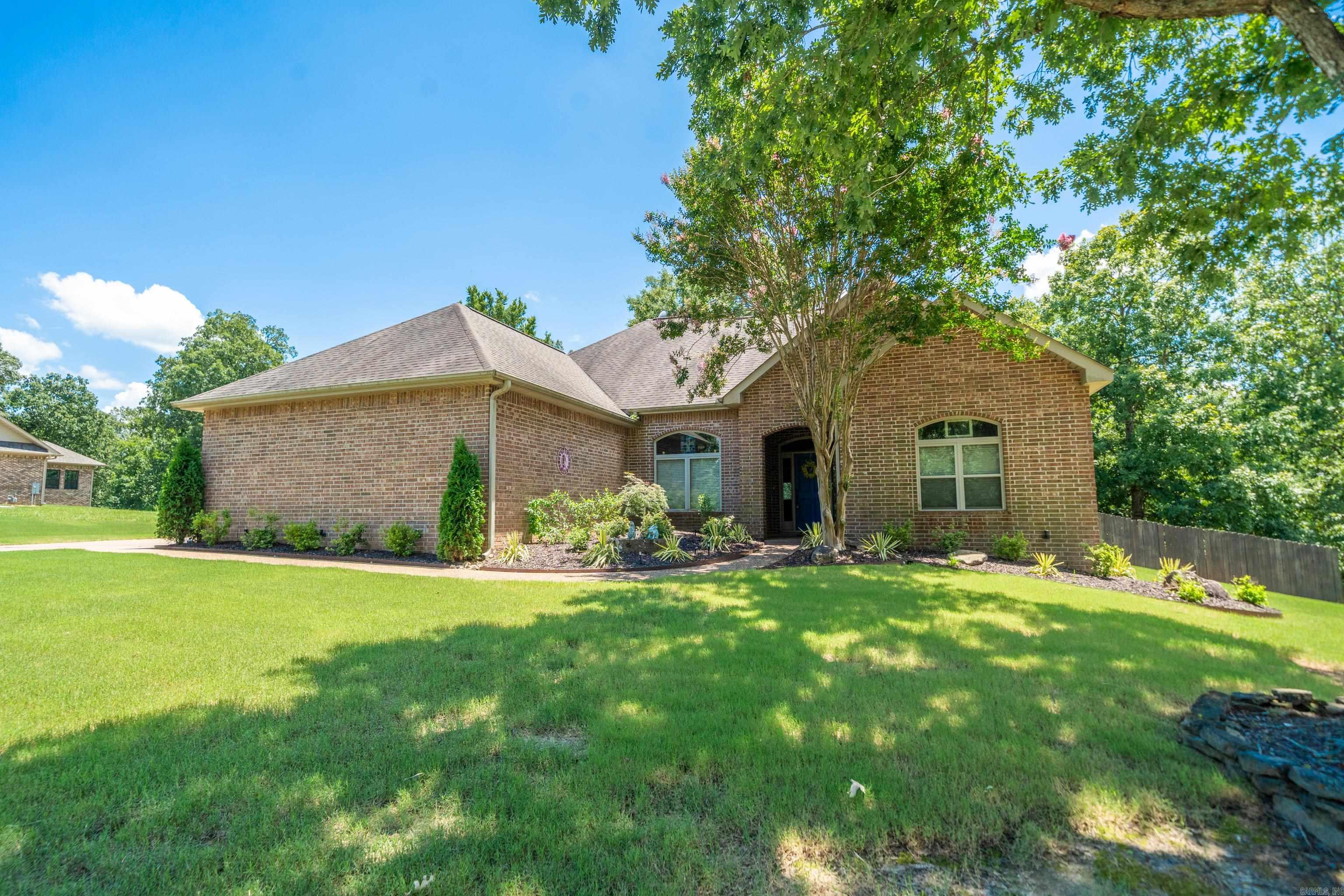 Discover your peaceful rural retreatāwhere country living meets everyday convenience. Located just far enough from the city to enjoy quiet evenings, yet only 20 minutes from shopping, dining, and hospitals. This all-level home offers seamless entry from the garage and throughout the house, with no steps to navigate. Inside, you'll find elegant tray ceilings in both the primary suite and dining room, and a soaring vaulted ceiling in the great room that adds an airy, open feel. Step outside to a spacious deck that overlooks a fully fenced backyard and beautifully manicured lawn. Complete with a sprinkler system and lush landscaping, this move-in-ready gem is a must-see!
