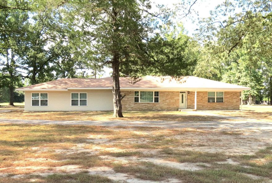 Welcome to this inviting 3 bedroom, 2 bath home nestled on a spacious 3.81 acre lot.  This well-maintained home features an open living and kitchen area.  Beautiful colors and fixtures throughout.  Primary bedroom ensuite has a siting area, large walk in closet, laundry room and beautiful bath with soaking tub and walk-in shower.   Split floor plan.   2 car carport on back of home, and detached carport.  Shop building with 1/2 bath, electric, ready to be a SHE SHED or MAN CAVE.  Partially fenced, with 2 gates.  Enjoy this peaceful rural living with plenty of room for flowers or a garden.  Don't miss this opportunity to own this beautiful home.  Call today for a tour.
