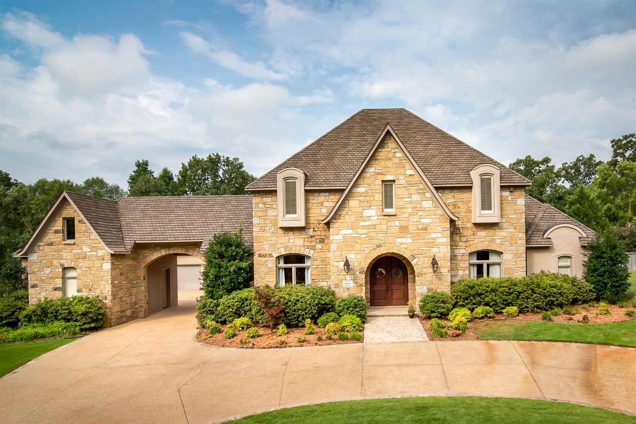 Stately & timeless custom-built home in one of Chenal's most prestigious gated neighborhoods. Classic architectural detailing & craftsmanship throughout. The main level features both formal & informal living areas, gourmet kitchen, spacious master suite & office. Upstairs offers 3 bedrooms, 2 baths & a game room. Additional features: heated marble floors on the main level, oak hardwoods upstairs, safe room, 4 car garage & workshop, circle drive & new roof & gutters. Flat backyard w/ a covered patio!
