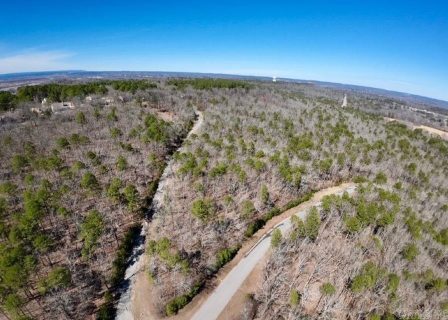 A PARK-LIKE SETTING! You have both wooded PICTURESQUE PRIVACY and a neighborhood that doubles as a PLAYGROUND. Within walking distance to The Course at Eagle Mountain this hard to find property offers a building location where EVERY SEASON is BEAUTIFUL! **All utility connections are at the expense of the Buyer**