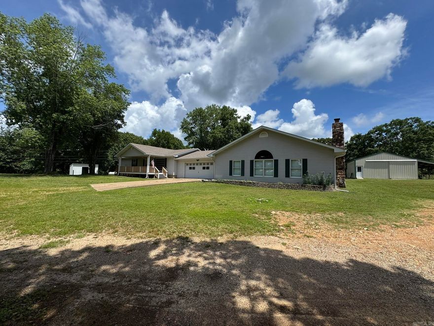 Your 5-acre country paradise awaits! This fully updated home is framed by mature trees and a large garden. Inside, enjoy fresh flooring, paint and updated plumbing throughout. The stunning new kitchen boasts granite countertops and custom backsplashes, all new stainless-steel appliances. Unwind in the massive 28x36 family room with a cozy fireplace, or retire to the large primary bedroom featuring a spacious walk-in closet. Both bathrooms are beautifully updated. Outdoor living shines with a covered deck, patio, and porch. Includes a 26x30 metal shop and 2 storage buildings. Best of all, you are just 10 minutes to town or Norfork Lake!