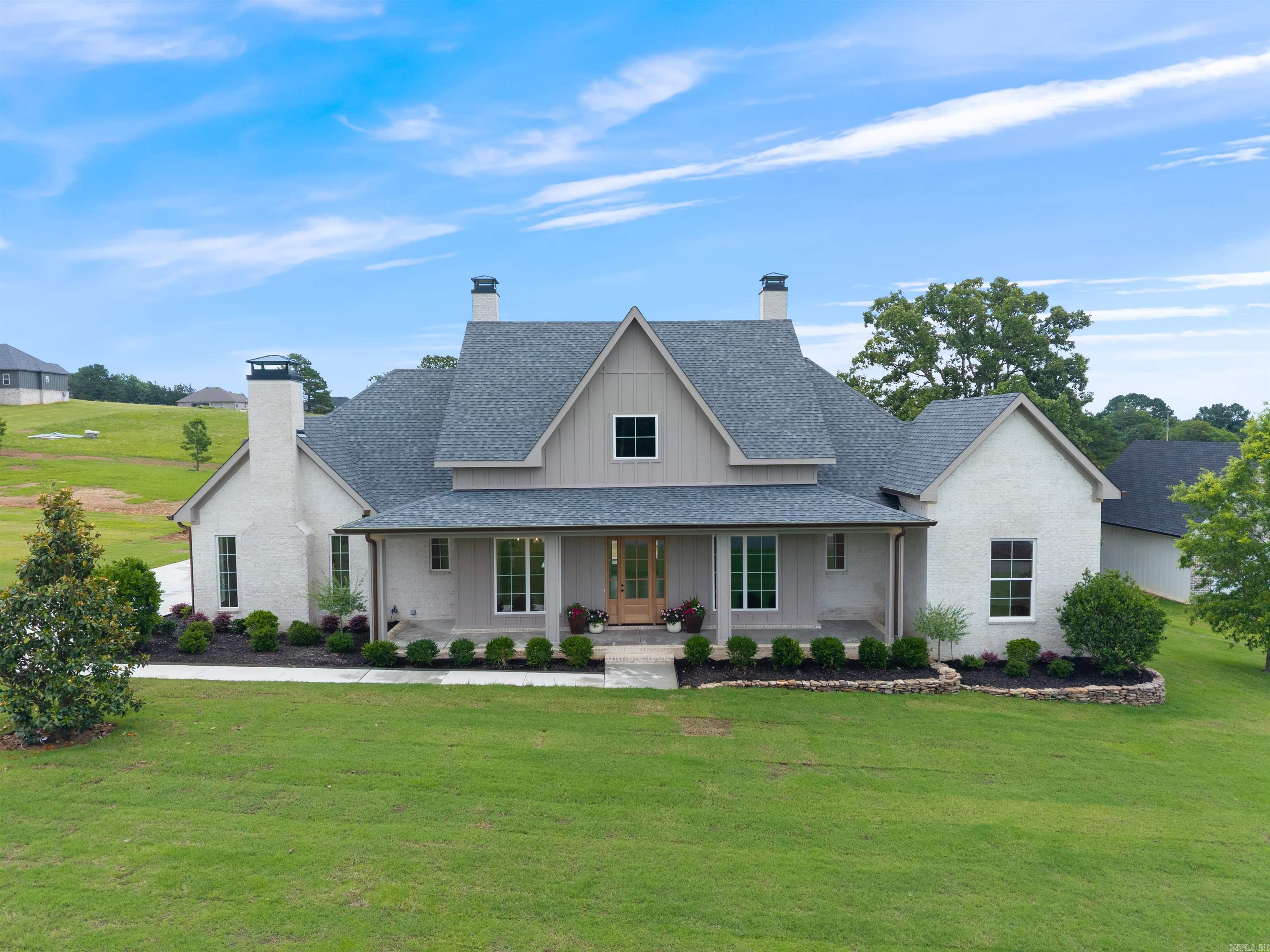 Stunning 4-BR home w luxury finishes on just under an acre! Welcome to your dream home! This beautiful designed 4BR, 3.5 Bath builders home boasts upscale features throughout. From the moment you arrive you will be captivated by the curb appeal, upgraded round pipe guttering, custom Hardie board siding, inviting covered porches & professional high quality workmanship. Step inside to discover luxury vinyl flooring & an open-concept layout perfect for entertaining. The gourmet kitchen features sleek quartz countertops, designer cabinetry, pantry, SS Appl, & premium features. Spacious living room is anchored by a coffered ceiling w beams, gorgeous electric FP & lots of natural light. Retreat to the oversized primary suite with a spa-inspired ensuite bath and generous walk-in closet space. Each additional bedroom is thoughtfully designed with quality in mind. There is a flexible room for an office or playroom that adds more space for your customized needs. If you peek under the hood you'll notice upgraded foam insulation! But it doesn't stop there - step onto the covered porch overlooking a sprawling yard ideal for relaxtion. Every detail has been carefully considered! See rmks