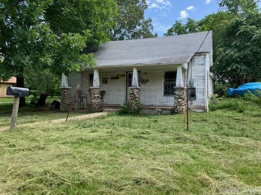 Corner lot in a very convenient location! Home is shaded by beautiful trees. Fixer upper. Home has some nice exterior character, potential to add a lovely covered front porch fronting Gilham Avenue when you redo the roof. Home needs a lot of work, but at a price that makes sense! Square footage is less than the courthouse shows, as the prior bathroom was removed and will need to be rebuilt.