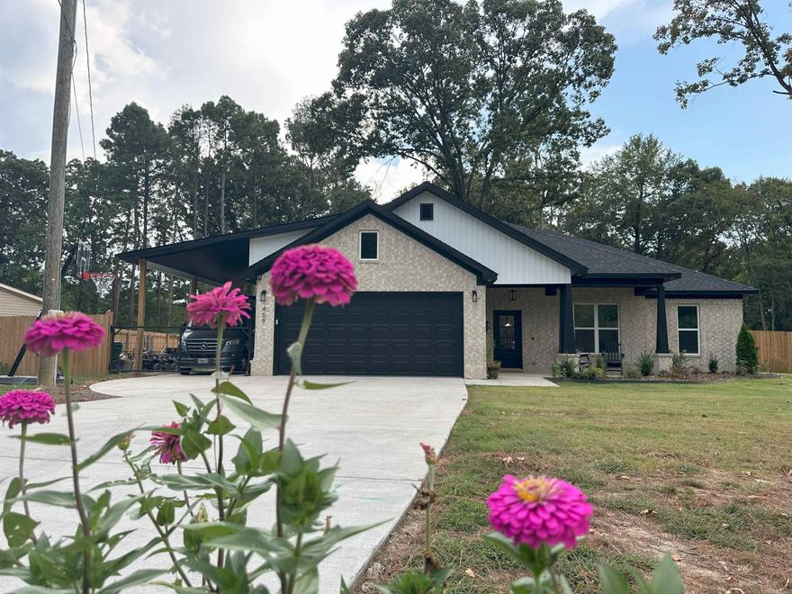 Perfect place to grow your family in this amazing homestead!  This home has gardens, green house, raised beds, a fully fenced yard surrounded by beautiful flowers that will attract butterflies and birds year round.   With such an amazing outdoor space, you may never step foot inside...but if you do the nearly 1800 sq ft of open living space will welcome you to spend time making great memories with family and friends around the island kitchen and large open living space.  Fill your huge pantry with garden fresh produce from your own backyard. The mudroom with built in seats and cubbies is a great place to kick off your boots.  A large master bedroom with walk in closets, soaker tub and a great shower make for an inviting place to rest and relax.  Across the home are two separate bedrooms with nice closets and a full bathroom.   The front porch and large back patio are a great way to enjoy the beauty and tranquility of country living at its best, yet you are only a short golf cart drive to enjoy a meal at one of the many fantastic eateries and gathering spots in downtown Benton!