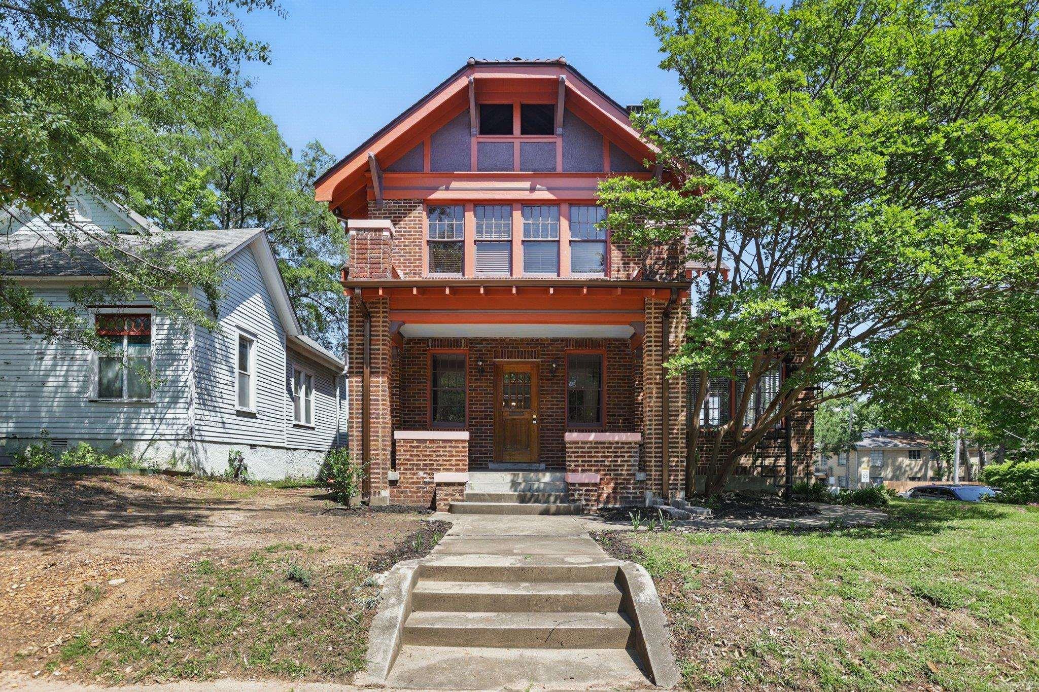 Welcome to 1523 Broadway in the Quapaw Quarter. This home was built around 1900 and still holds onto some of its original character. You'll find exposed brick, original hardwoods, and three gas fireplaces, along with modern updates in the main living areas. Upstairs you'll find three bedrooms and a full bath. There's a half bath on the main floor, and the finished basement includes another full bathroom. It's a great setup for a guest room, office, or extra hangout space. The pantry off the kitchen is spacious with plenty of room for dry goods, dishes, and small appliances. A covered carport keeps you dry on rainy days, and there's additional off-street parking as well. Located in the Capitol Zoning District, you're just minutes from SoMa, Pettaway, and everything downtown has to offer.