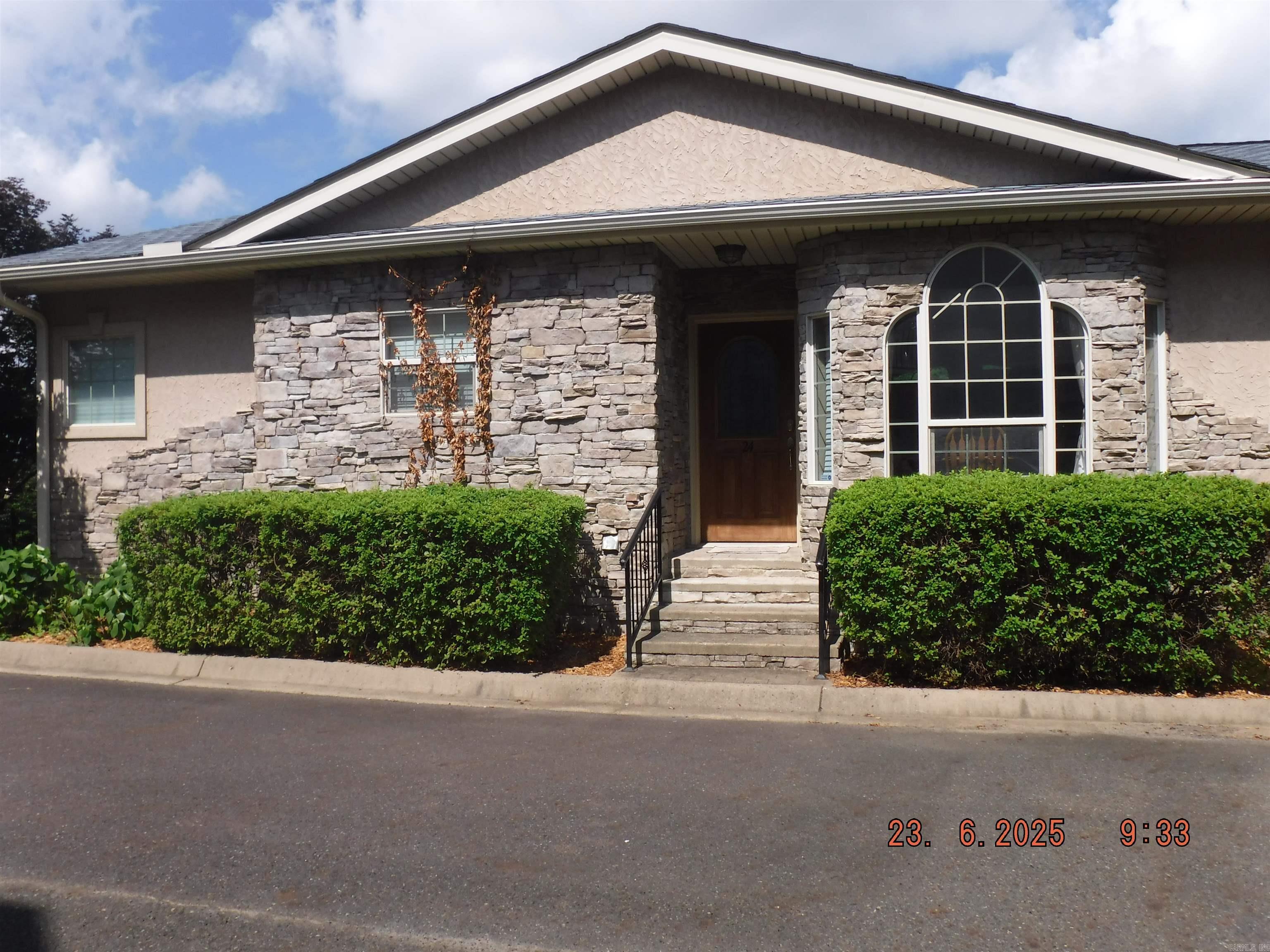 * Lake Hamilton * Stunner with space for everyone! Great view of LH and just a few mins off of main channel water! This open concept living/dining/kitchen areas has tall ceilings, stone fp, and access to the newly remodeled outside patio from the living room and master suite. The eat in kitchen is large enough to accommodate 6-8 person table along with a breakfast bar. The master suite(main floor) is huge with tons of windows and access to the outside patio. Huge walk in closet. Master bathroom has a double vanity and separate walk in shower and bathtub. As you stroll down stairs you have 2 huge bedrooms that could easily sleep multiple people and a full bathroom. Through the 2nd bedroom closet is access to a huge under home storage area. Perfect for life vest, toys, and additional storage. Downstairs offers and additional access point to outside. From the downstairs door your are close to the pool and boat docks.
