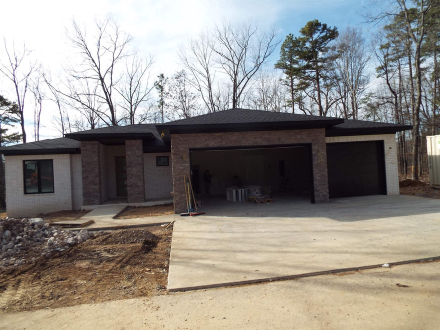 AFFORDABLE LUXURY NEW CONSTRUCTION! Enjoy the safety of gated Hot Springs Village and the convenience of this location.  It is a quick commute to Hot Springs via the new bypass and just minutes from West Side stores.  This home boasts an open floor plan, luxury vinyl floors throughout, granite countertops, a walk-in shower in the master and a gas fireplace for cozy evenings. In addition it has a three car garage for your toys and an office nook to help get your work done.  It is located in the highly rated Fountain Lake School District, just minutes from Lake Pineda and Lake Coronado with the Coronado Center tennis facility and the Fitness Center with an indoor pool.  With all of this at this price, it won't last long.  A $1500 buy-in fee required for new residents.