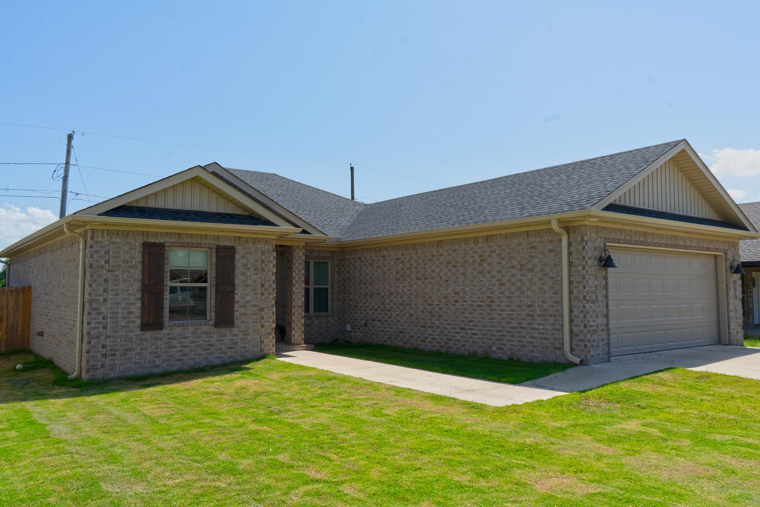 If you like bells and whistles you will love this home! It has tall ceilings revealing its grand great room. The floor covering in public areas and baths have wood grain tile. The open living space makes a lovely home for entertaining and family get togethers. The kitchen cabinets are black with quartz countertops. It makes for convenience to dining area. The master bedroom has the wow factor. The suite bath has double sinks but are separated by storage. The master bath has two separate choices for bathing. A large soaking tub and an additional walk in shower. This makes a great get away suite. The two additional bedrooms have ample space for guests and office. The bath for these rooms has beautiful tile and is larger. The backyard has privacy fence for outdoor enjoyment. This house is move-in ready. Make this home your home.