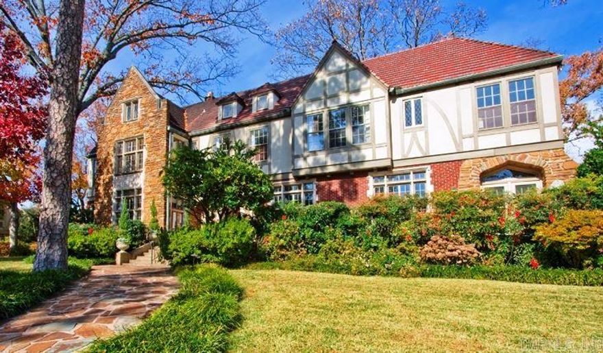 Handsome English Tudor Estate located on over 3 lots in beautiful Prospect Terrace.  Designed for family living and spectacular entertaining!  Magnificent foyer flanked by the spacious living rm. and banquet sized dining.  Family keeping room off the kitchen and breakfast area.  Wide staircase leads past original stain glass windows.  Wonderful master suite and three addit. bedrm suites on the 2nd level along with full guest quarters or playrm.  Side load garage.  Benchmark of Heights Architecture and Charm