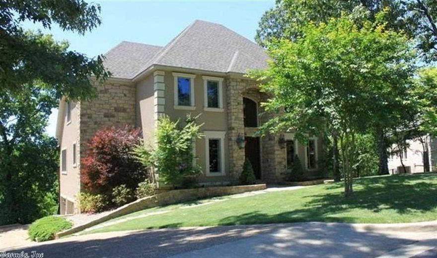 VERY ELEGANTLY DESIGNED CUSTOM HOME WITH MANY DESIGNER TOUCHES TO INCLUDE HAND PAINTED DETAILS, CUSTOM TILEWORK, BEAUTIFUL WOOD FLOORS, GRANITE ALL SET ON AN OUTSTANDING LOT IN RED OAK RIDGE WITH A GREAT WATER VIEW.  THE COOK OF THE FAMILY WILL LOVE THE GOURMET KITCHEN FOR ALL TYPES OF ENTERTAINING.  THE OPEN FLOOR PLAN OFFERS SOARING CEILINGS  IN THE LIVING ROOM AND A GRAND ENTRANCE.  NATURAL GAS GENERATOR.  THIS PROPERTY OFFERS MORE CUSTOM FEATURES, TOO MANY TO LIST.    CALL TODAY FOR YOUR PERSONAL TOUR.