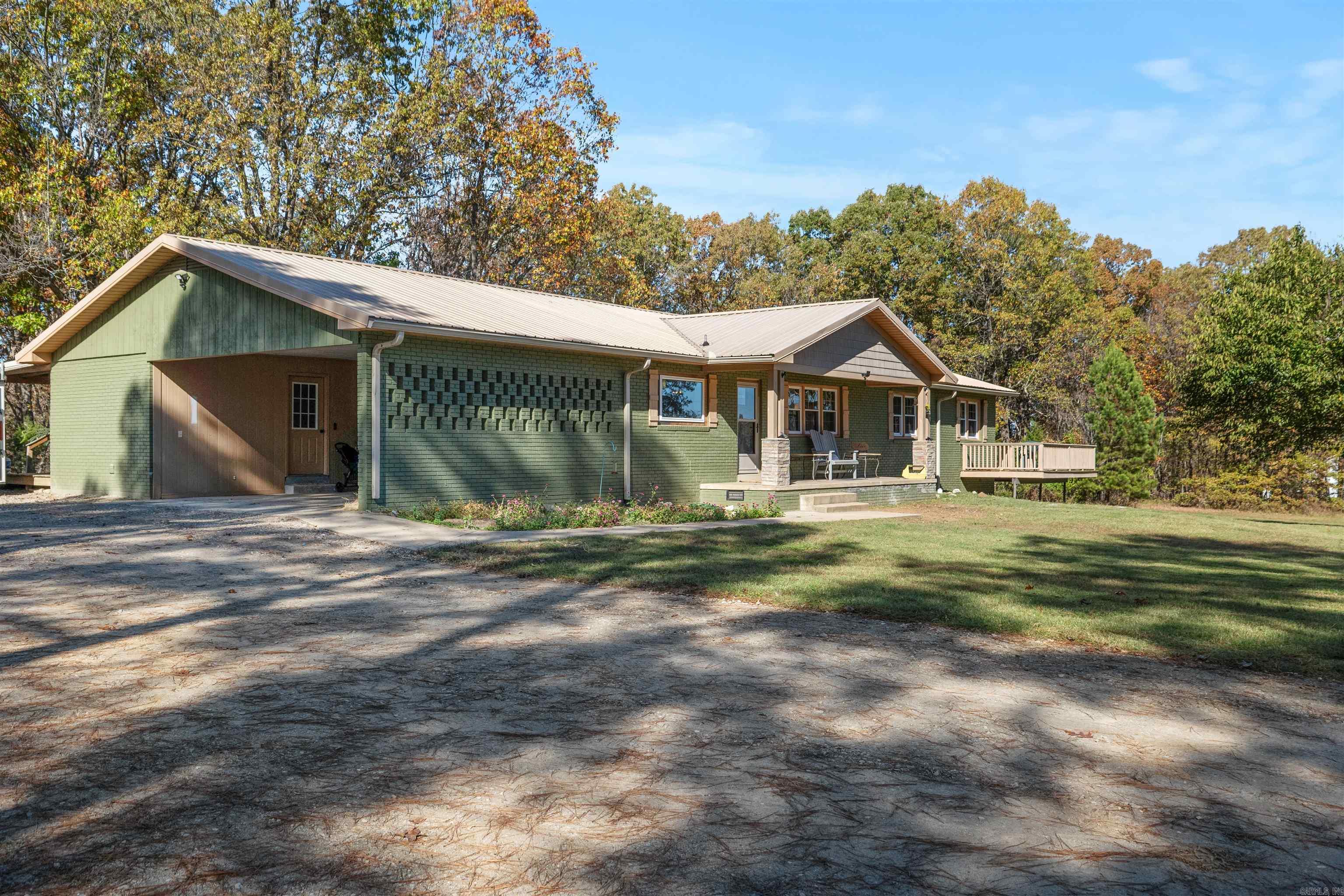 Welcome to this beautifully updated all-brick 4-bedroom, 3-bathroom home, ideally situated just outside Pocahontas city limits yet only minutes from town and close to the country club and golf course! This 1980s gem combines modern amenities with classic charm, featuring a fully renovated kitchen with a breakfast bar open to the living area, an electric fireplace, central heat and air, and a top-of-the-line water filtration system with reverse osmosis. The home also offers a spacious laundry area, multiple decks perfect for outdoor entertaining, and a large primary suite. Enjoy peaceful country living with quick access to all amenities—this move-in-ready home is a must-see!