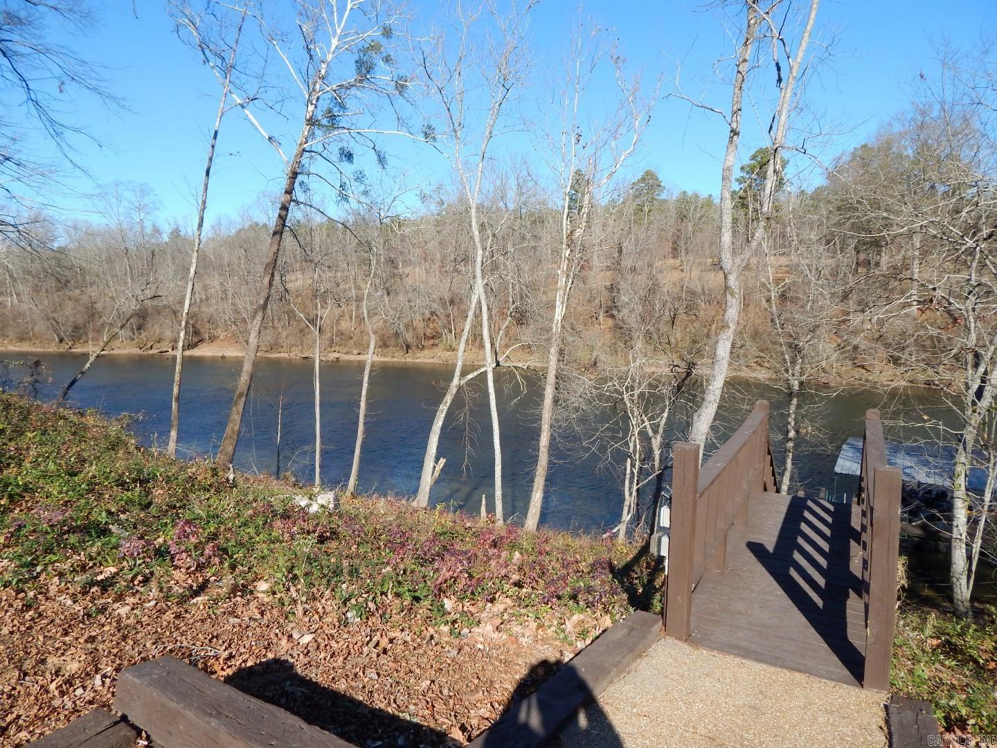 Gated RIVERS EDGE SUBDIVISION with the LITTLE RED RIVER just across the street!! Zero Maintenance Subdivision with access to river just a few steps away from community boat dock and community pool. All ground maintenance, private roads & pool access are included in this worry-free vacation subdivision. Mountain views can be seen from your own dream river home, come check out this great lot and remember to bring your fishing gear!!!
