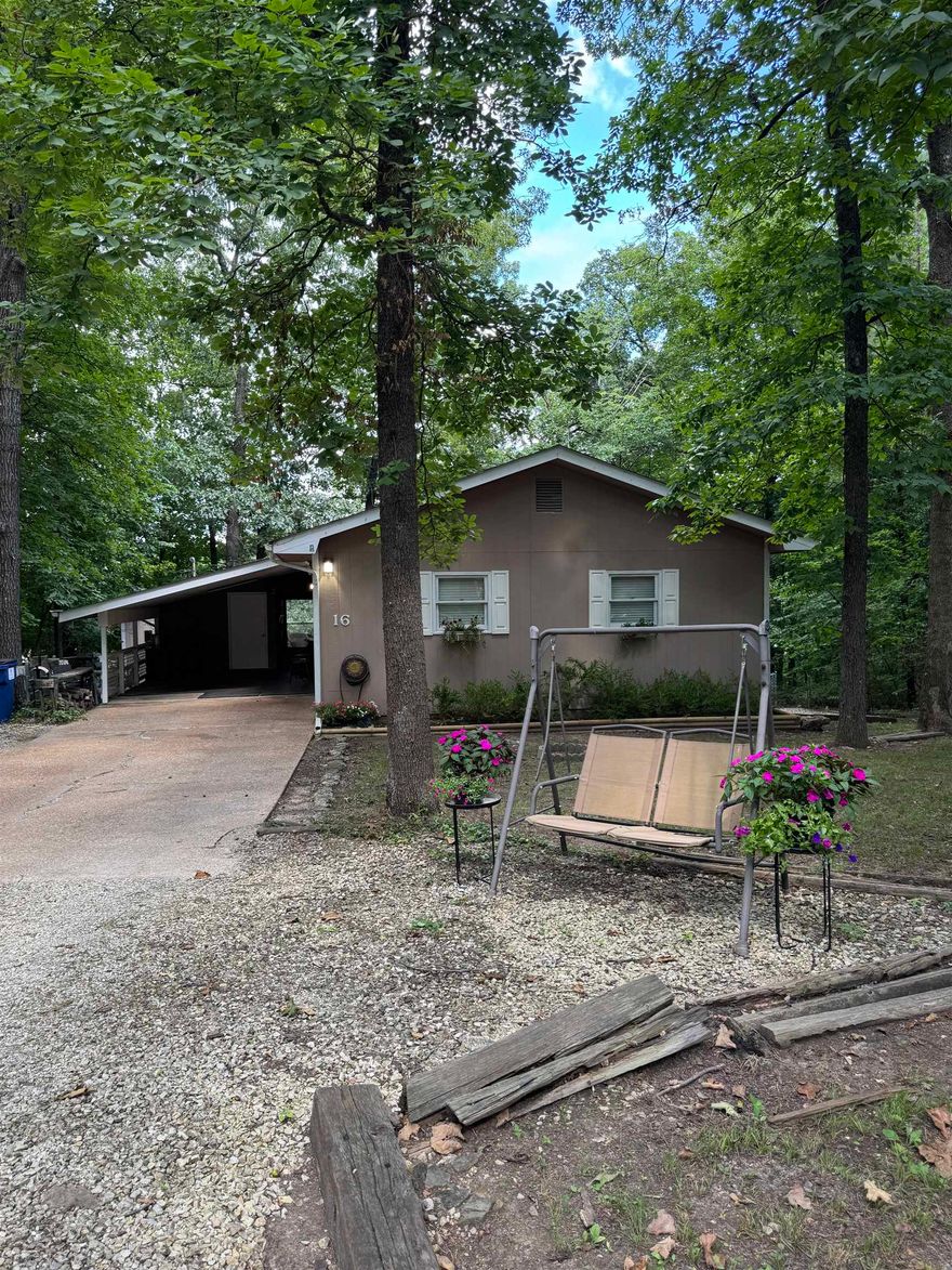CUTE, CUTE, CUTE, and move-in ready to boot!  This once successful AirBnB is ready for it's new owners and next chapter!  Conveniently close to Lake Sequoyah and Lake Thunderbird with seasonal views of Lake Sequoyah, this charmer features 2 bedrooms 1.5 baths, large living/dining room combo, a kitchen chocked full of cabinets, counterspace, and a wine fridge!  1 year old LVP flooring throughout, new light fixtures, cabinet hardware, door hardware, paint.  Roof is 2 years old, HVAC is 2.5 years old.  Carport with storage room, shed, back porch, and fenced in yard are some other must haves!  The home will convey with 2 additional lots at closing (one on each side of the house).  Call your favorite Realtor today for a showing!  This one will not last!